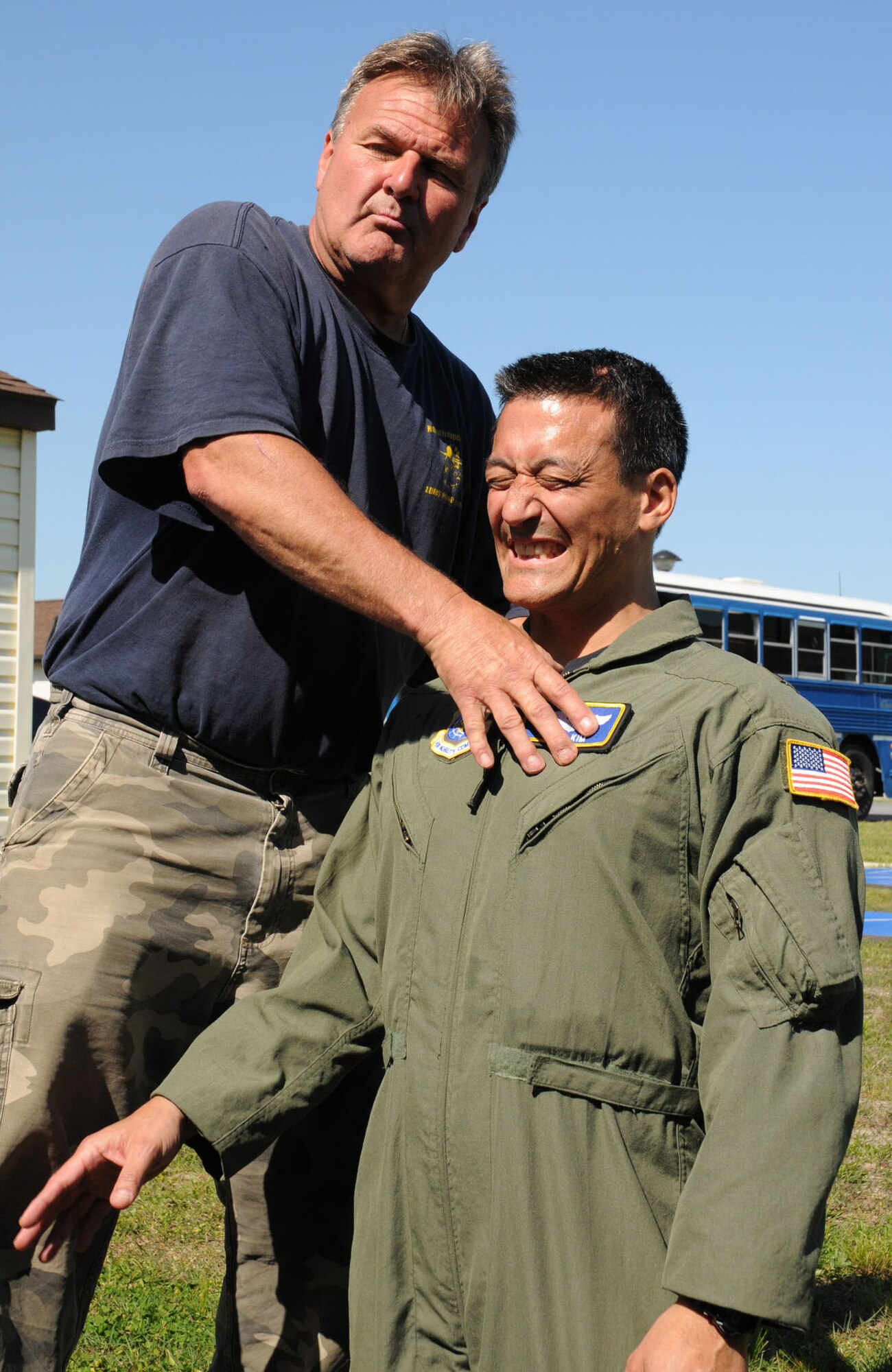 Delaware State Police Corporal John Feby demonstrates effective use of pressure points on Brig. Gen. Michael D. Kim, mobilization assistant to the director of operations at Headquarters Air Mobility Command, Scott Air Force Base, Ill. The DSP troopers educated more than 60 Air Force Reserve officers about ground fighting defense tactics at the National Guard Bethany Beach Training Site April 30 near Dover AFB, Del. The training was part of the Junior Officer Leadership Development course that ran April 29 through May 2. (U.S. Air Force photo/Capt. Marnee A.C. Losurdo)
