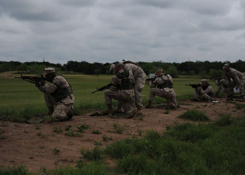Fort Wolters,Texas— Dyess Marines fire their rifles at targets May 15 to qualify during field training.  Dyess Marines are assigned to Detachment 1 in support of motor transport assets. They are required to qualify with the rifle annually by shooting from the 200, 300 and 500 yard marks from the sitting, kneeling, standing and prone positions. Weapons qualification is based on a points system earning them marksman, sharp shooter or expert title. (U.S. Air Force photo/ Airman 1st Class Brittney Smolinski)
