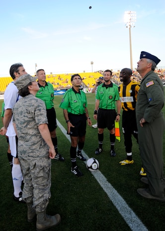 Col. Martha Meeker, left, and Col. Mike Speer, right, call a coin in the air during the opening ceremony for Military Appreciation Night at the Charleston Battery game May 15, 2010 at Blackbaud Stadium on Daniel Island. Both commanders served as honorary team captains during the military appreciation game. Colonel Meeker is the commander of Joint Base Charleston and Colonel Speer is the vice commander of the 315th Airlift Wing at Joint Base Charleston. (U.S. Air Force photo/Senior Airman Timothy Taylor)