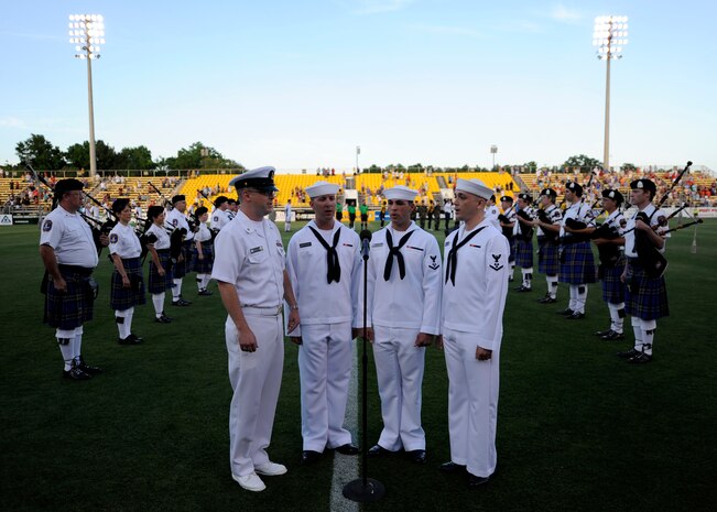 Members of the U.S. Navy sing the national anthem during the opening ceremony for Military Appreciation Night at the Charleston Battery game May 15, 2010 at Blackbaud Stadium on Daniel Island. The Charleston Battery professional soccer team traditionally holds two military appreciation nights during the year. (U.S. Air Force photo/Senior Airman Timothy Taylor)