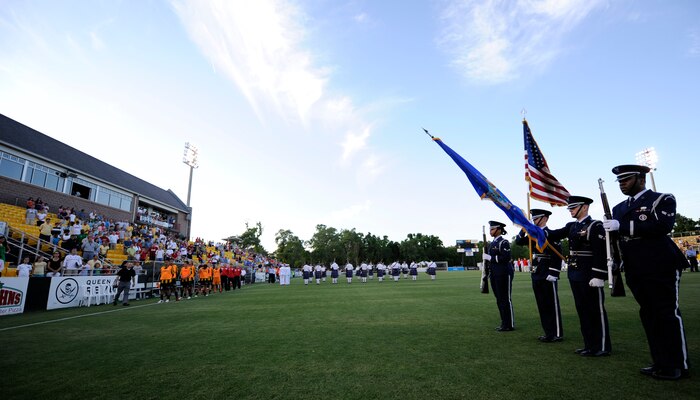 Joint Base Charleston Honor Guard members present the colors during the opening ceremony for Military Appreciation Night at the Charleston Battery soccer game May 15, 2010 at Blackbaud Stadium on Daniel Island. The opening ceremony included presentations from police bagpipers, U.S. Air Force Honor guard members rendering the colors, U.S. Navy singing the national anthem and honorary team captains flipping the coin. (U.S. Air Force photo/Senior Airman Timothy Taylor)