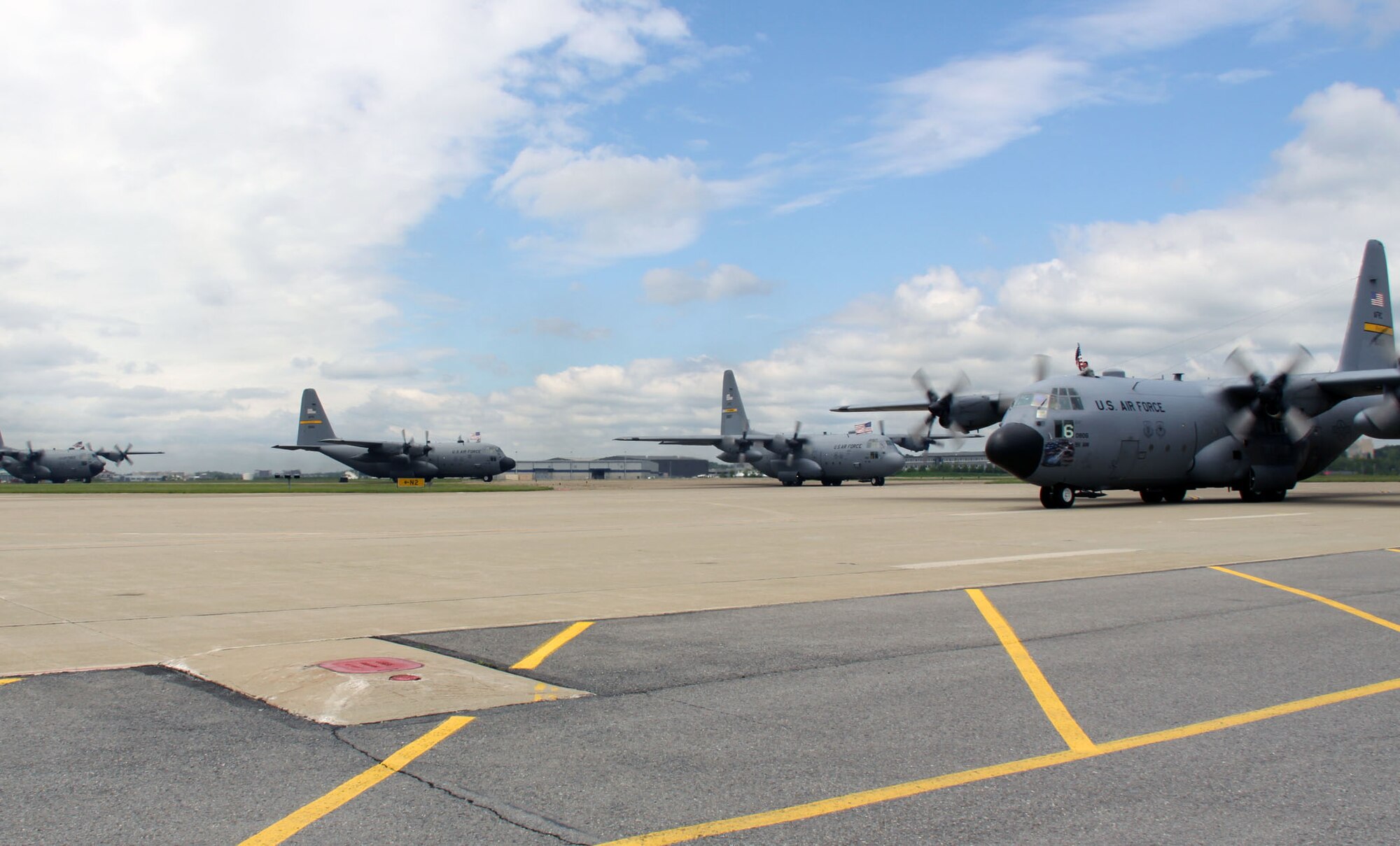 A four ship formation of C-130s taxi's in to the 911th Airlift Wing, May 19, 2010 loaded with personnel returning home from a 120-day AEF rotation in support of contingency operations overseas. The planes and personnel arriving were part of an operations and maintenance package which sent nearly 20 percent of the 911th's Reserve workforce and four C-130H aircraft overseas. (photo by Lt. Shawn M. Walleck, 911th Public Affairs)
