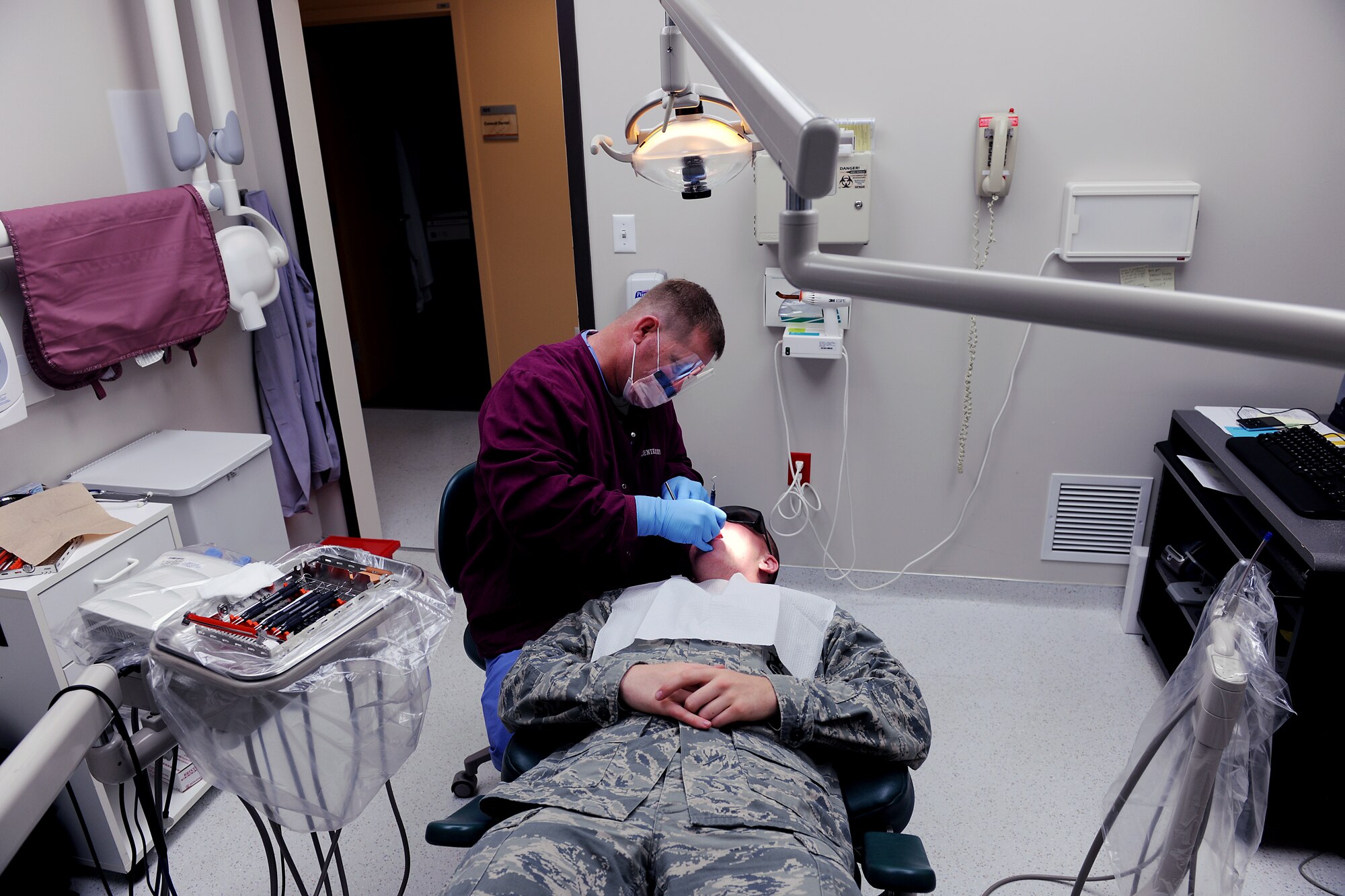 MOODY AIR FORCE BASE, Ga. -- Staff Sgt. Steven Smith, 23rd Aeromedical Dental Squadron dental technician, cleans the teeth of Airman 1st Class Edward Huffman, 822nd Security Forces Squadron member, during a routine dental cleaning here May 12. Airmen are required to have a routine dental cleaning and check-up annually. (U.S. Air Force photo by Airman 1st Class Joshua Green/RELEASED)