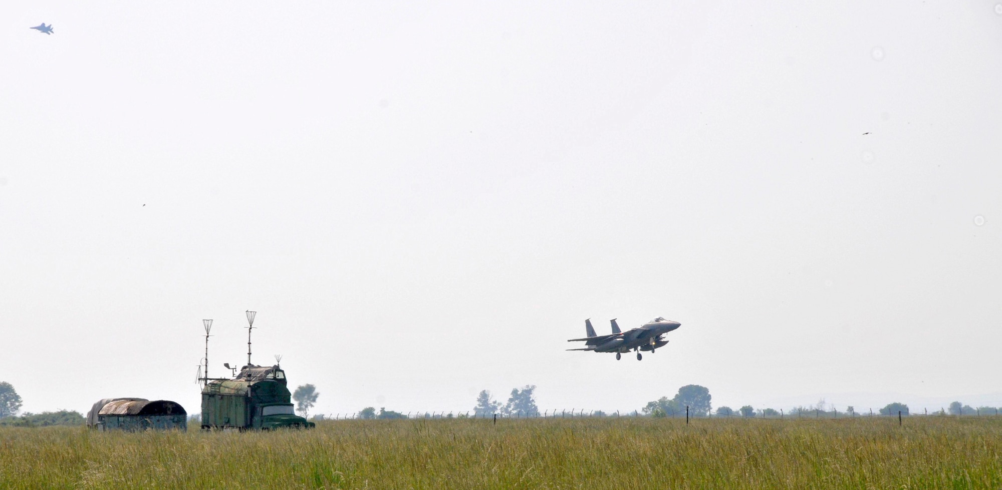 An F-15 Eagle pilot lands May 13, 2010, at Graf Ignatievo Air Force Base in Plovdiv, Bulgaria. Airmen from the 48th Fighter Wing are in Bulgaria taking part in Sentry Gold, an exercise developed to familiarize U.S. pilots with the MiG airframes, build partnerships with the Bulgarian air force and assist them in their continued integration into NATO operations. The F-15 is from the 493rd Fighter Squadron at RAF Lakenheath, England. (U.S. Air Force/courtesy photo)
