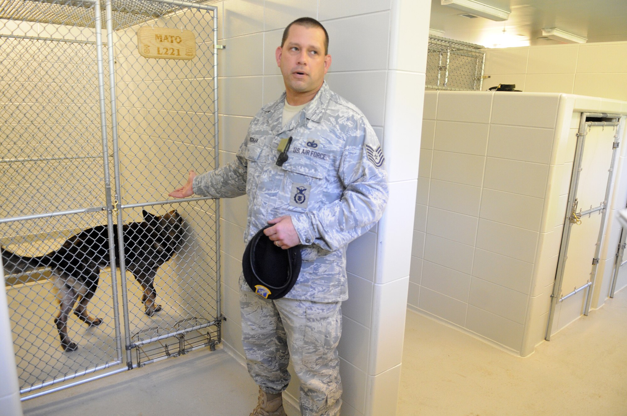 TSgt. Keith Wozniak talks about the improved conditions for the military working dogs. U. S. Air Force photo by Sue Sapp