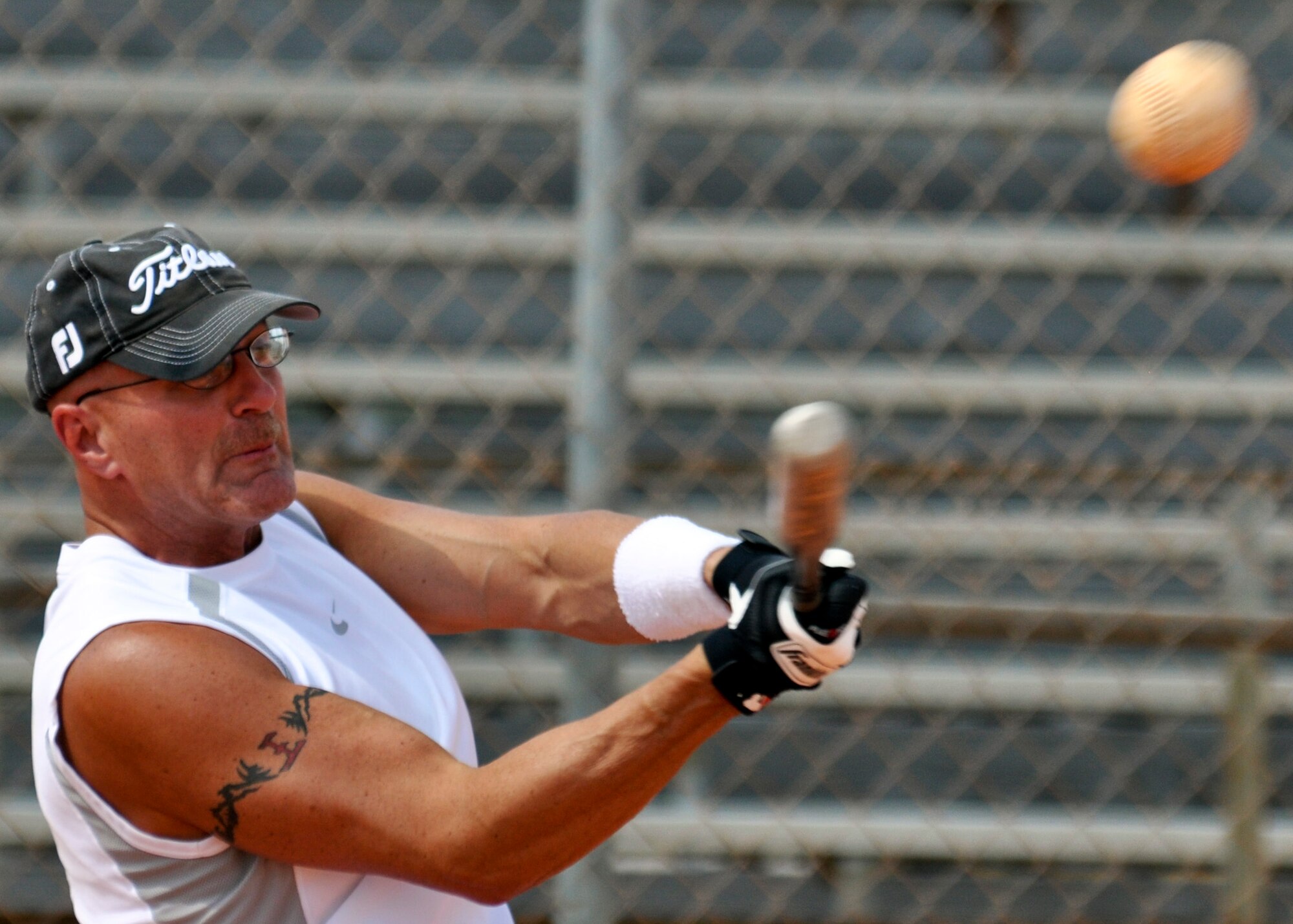 Chief Master Sgt. Steve White, 96th Security Forces Squadron, aims for the fences during the annual Chiefs V/S Eagles softball match at Eglin Air Force Base, Fla., May 17.  The Eagles narrowly won 9-8 in extra innings.  (U.S. Air Force photo/Samuel King Jr.)

