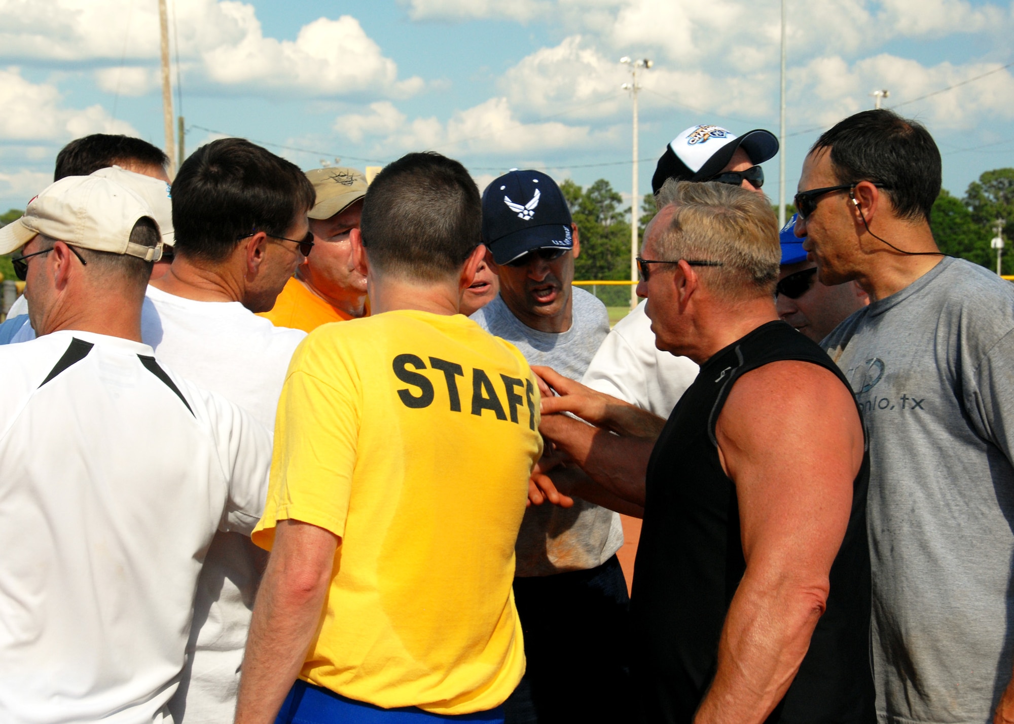 The Eagles team bring it in during the annual Chiefs V/S Eagles softball match at Eglin Air Force Base, Fla., May 17.  The Eagles narrowly won 9-8 in extra innings.  (U.S. Air Force photo/Samuel King Jr.)
