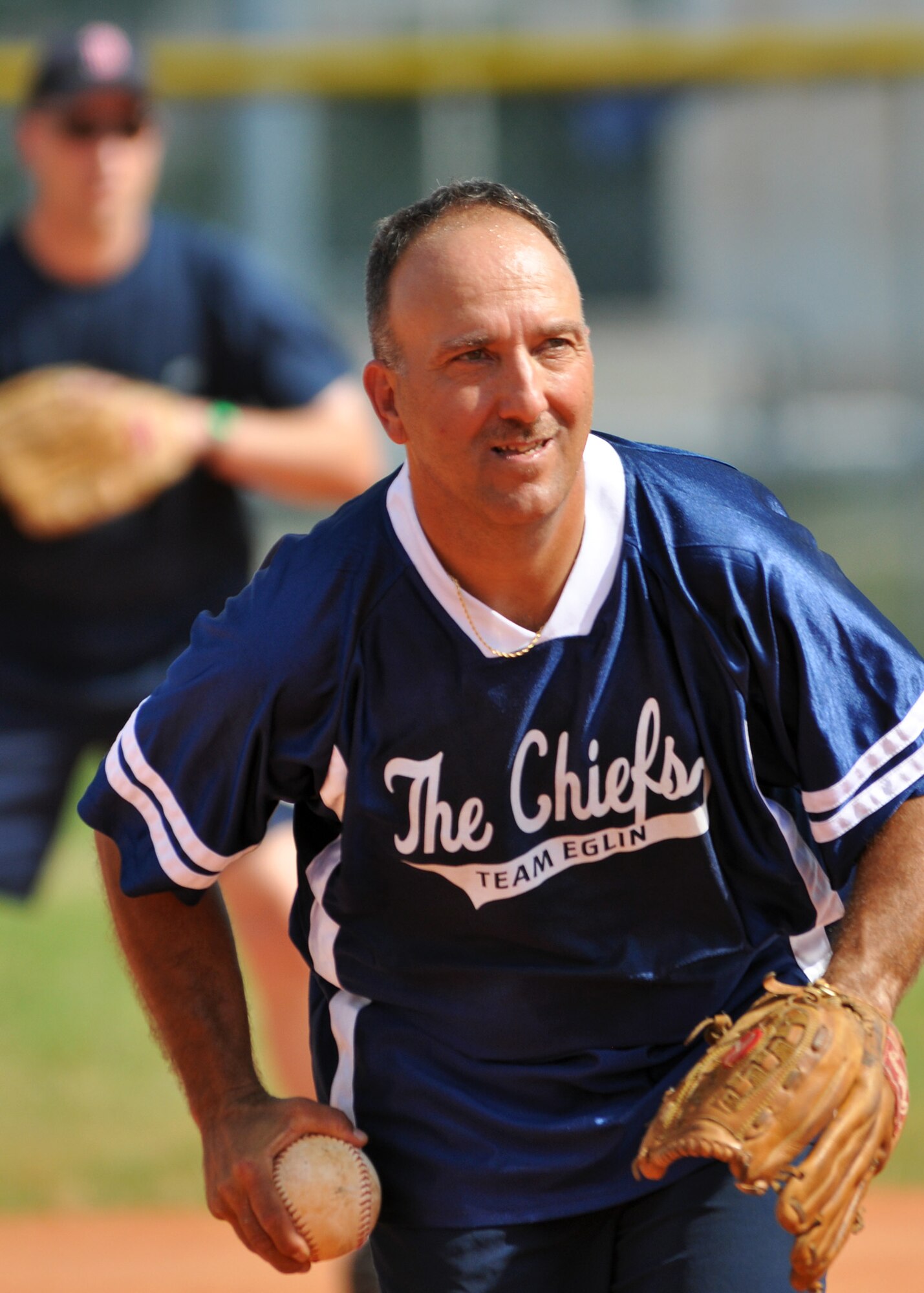 Chief Master Sgt. Dale Mullins, 46th Aircraft Maintenance Squadron, goes for the strike-out during the annual Chiefs V/S Eagles softball match at Eglin Air Force Base, Fla., May 17.  The Eagles narrowly won 9-8 in extra innings.  (U.S. Air Force photo/Samuel King Jr.)
