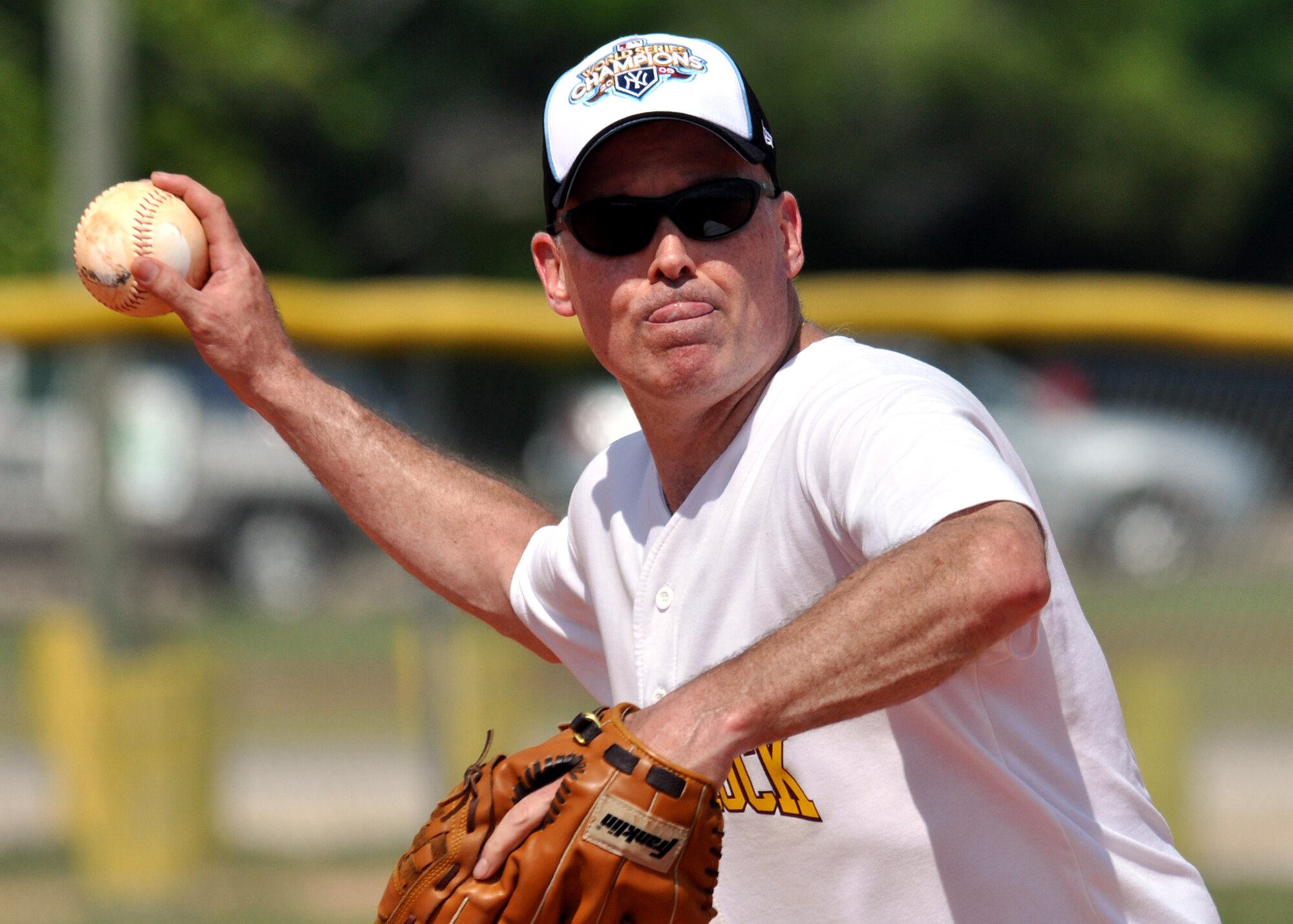 Col. Kevin McElroy, 53rd Electronic Warfare Group, goes for the out at first base during the annual Chiefs V/S Eagles softball match at Eglin Air Force Base, Fla., May 17.  The Eagles narrowly won 9-8 in extra innings.  (U.S. Air Force photo/Samuel King Jr.)
