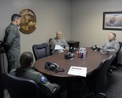 MINOT AIR FORCE BASE, N.D. -- Maj. Gen. Roger Burg, 20th Air Force commander, discusses issues concerning the 54th Helicopter Squadron with Lt. Col. Ronald Tewksbury, 54th Helicopter Squadron commander, Col. Robert Walker, 91st Operations Group commander, and Col. Fred Stoss, 91st Missile Wing commander, during his visit here May 13.  This visit was a farewell tour of Minot AFB before his upcoming retirement. (U.S. Air Force photo by Staff Sgt. Keith Ballard)