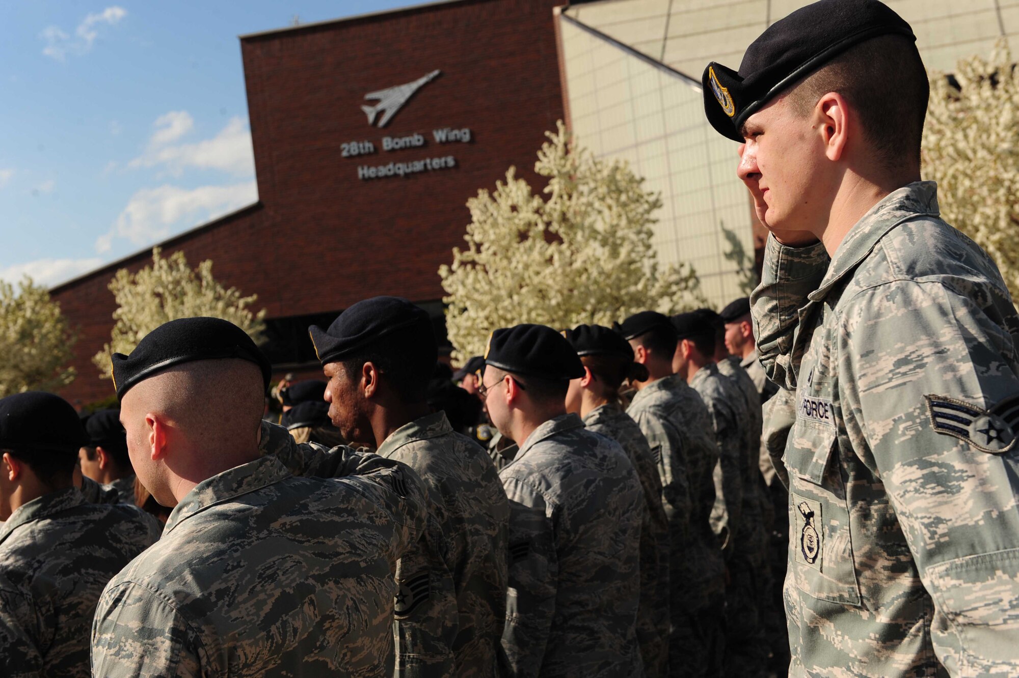 ELLSWORTH AIR FORCE BASE, S.D. -- Members of the 28th Security Forces Squadron salute the flag during a National Police Week Retreat ceremony, May 14. National Police Week has honored local, state, and federal actively serving and fallen officers for 47 years. (U.S. Air Force photo/Airman 1st Class Corey Hook) 