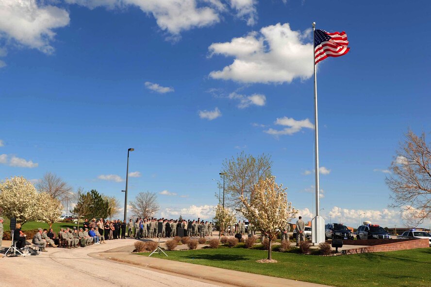 ELLSWORTH AIR FORCE BASE, S.D. -- Members of the 28th Security Forces Squadron and South Dakota police officers stand in formation at the National Police Week Retreat ceremony, May 14. National Police Week is an observance in the United States which pays tribute to local, state and federal law enforcement officers. (U.S. Air Force photo/Airman 1st Class Corey Hook)