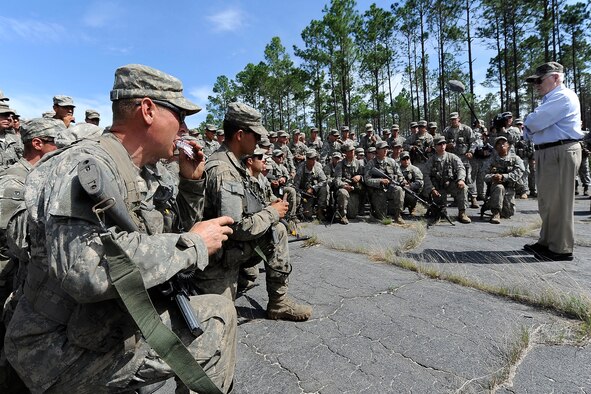 Defense Secretary Robert M. Gates talks with Army Ranger trainees after delivering them Snickers bars during his visit to the 6th Ranger Training Battalion on Eglin Air Force Base, Fla, May 15.  (DoD photo/ U.S. Air Force Master Sgt. Jerry Morrison.)
