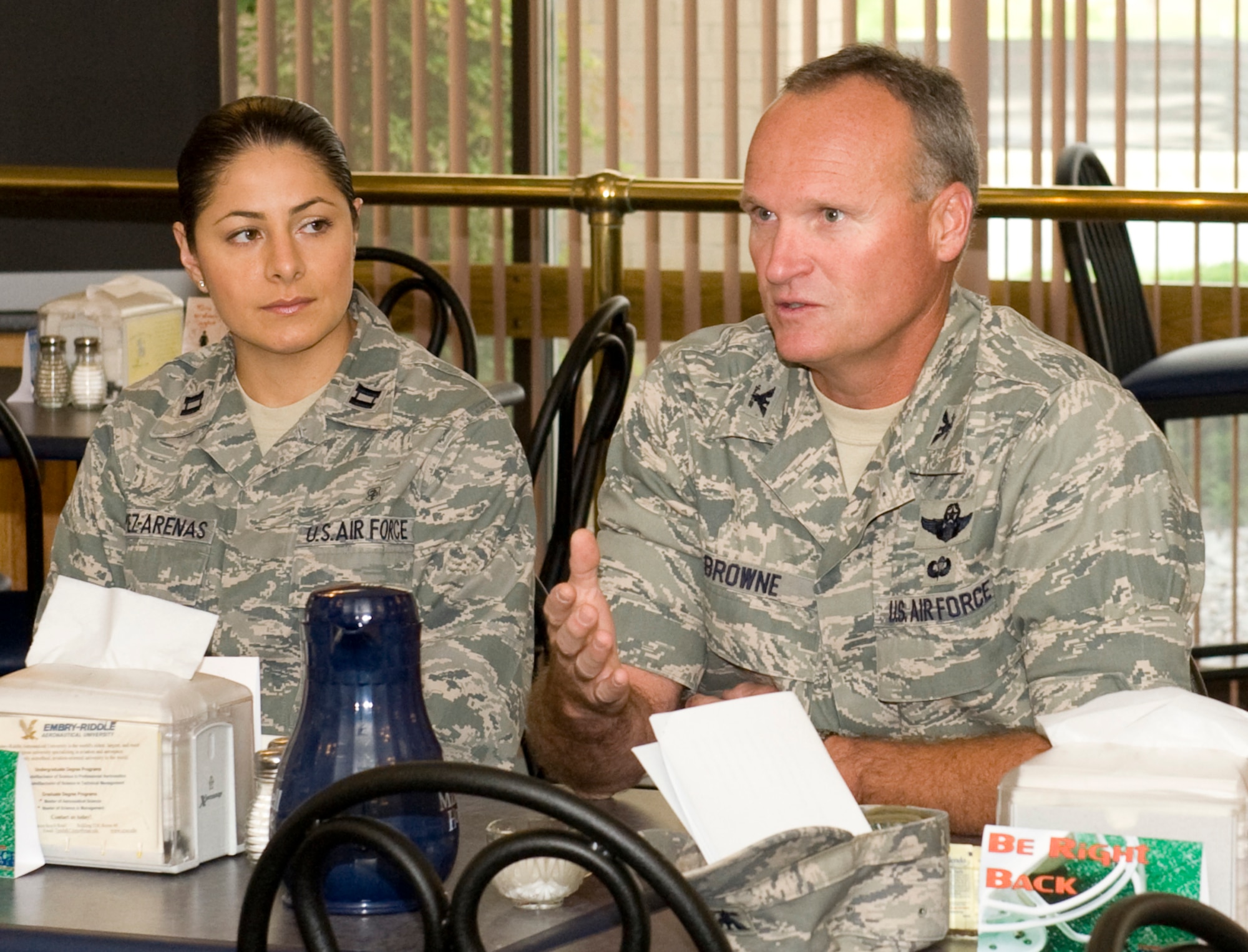 Captain Monica Gomez-Arenas, 325th Medical Support Squadron medical information systems flight commander, and Colonel James Browne, 325th Fighter Wing commander, attend the NCO monthly breakfast May 11 at the Berg Liles Dining Facility. (U.S. Air Force by Jonathan Gibson)
