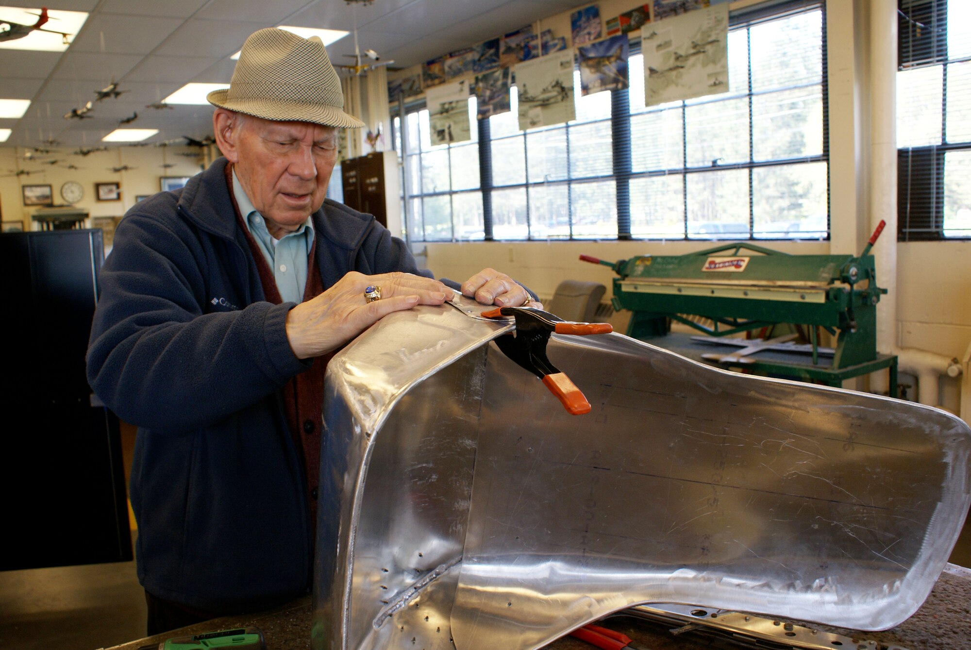 Lt. Col. (ret.) Donald Tracy works on a radio operator's seat he has fabricated from scratch.  The seat is for a B-18 bomber that a volunteer restoration crew has been rebuilding for over 20 years.  Colonel Tracy is a command pilot with over 5,000 hours, and retired from McChord in 1968.  (U.S. Air Force photo/Capt. Ali Kojak)

