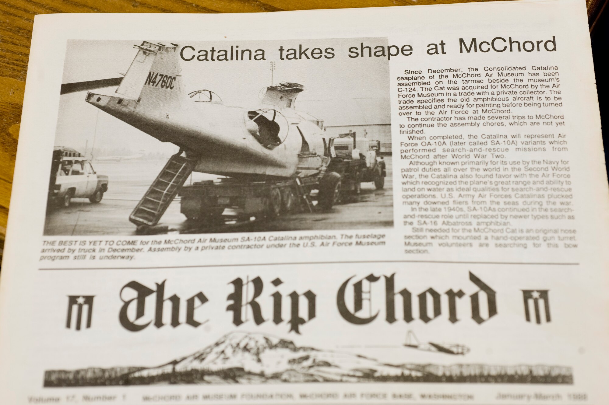 An Air Force OA-10A seaplane, known in the Navy as a PB-Y Catalina, is currently being restored by a volunteer crew from the McChord Air Museum.  The Catalina arrived at McChord Field on a truck in 1988, and the wings had been sawed off.  The crew has completely rebuilt the aircraft, and the project is about 98 percent complete.  The newspaper photograph shows the condition of the aircraft when it arrived.  (U.S. Air Force photo/Abner Guzman)

