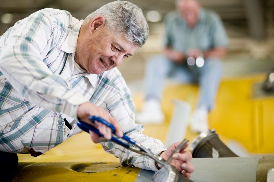 Tech. Sgt. (ret.) Tom Caparella works to waterproof the engines of a PB-Y Catalina.  The PB-Y rescue airplane was stationed at McChord FIeld as part of the 43rd Air Rescue Squadron in the late forties.  Sergeant Caparella served in both the Army and Navy before retire from the Air Force, and has been volunteering at the museum since 1991.  (U.S. Air Force photo/Abner Guzman)

