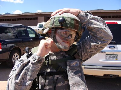 Senior Airman Nathan Joiner, member of the 689th Combat Communications Wing Guardian Challenge Security Forces team adjusts his helmet prior to the start of his team’s tactics event May 16. The 689th team is comprised primarily of members from the 3rd Combat Communications Group, Tinker Air Force Base, Okla.  (US Air Force photo by Master Sgt. Robert Talenti)