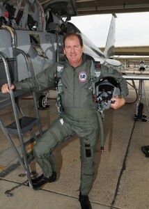 Pro golfer Kevin Johnson pauses for a photo prior to an orientation flight on a T-38 Talon at Randolph Air Force Base, Texas. The orientation flights were offered to the golfers, as part of the Air Force recruiting program, during the PGA Valero Open Tournament in San Antonio. (U.S. Air Force photo by David Terry)
