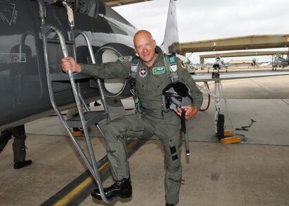 Pro golf caddie Bradley Whittle  pauses for a photo prior to an orientation flight on a T-38 Talon at Randolph Air Force Base, Texas. The orientation flights were offered to the golfers, as part of the Air Force recruiting program, during the PGA Valero Open Tournament in San Antonio. (U.S. Air Force photo by David Terry)