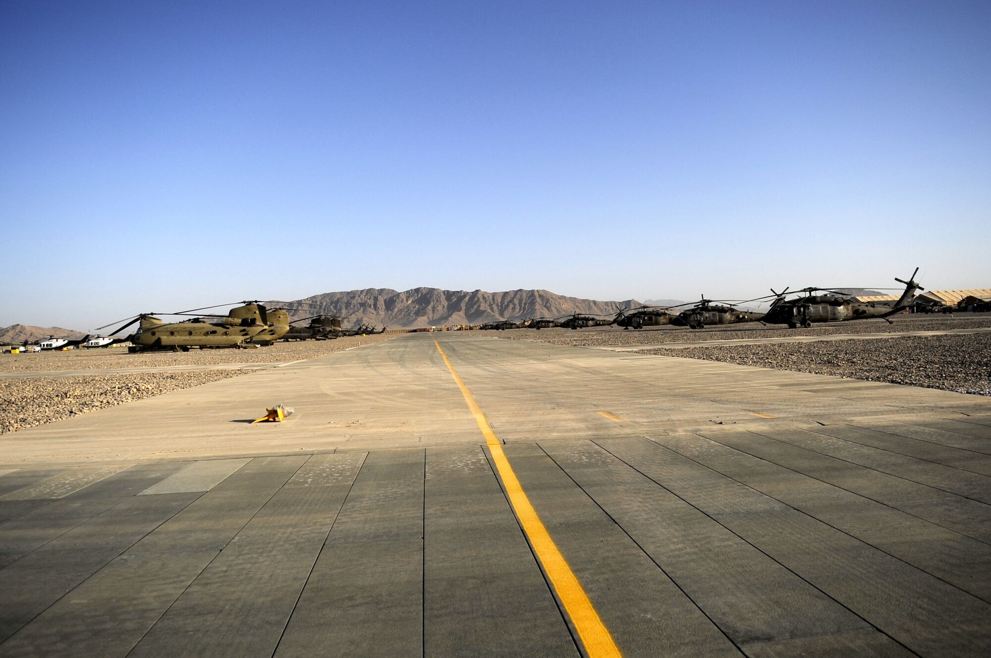 Members of the 809th Expeditionary Red Horse Squadron just completed laying more than 1.5 million cubic square feet of matting on Kandahar Airfield on May 15.  The area is used for taxiways and parking Army helicopters and is worth an estimated $700,000 dollars.  (U.S. Air Force photo by Senior Airman Nancy Hooks/Released)
