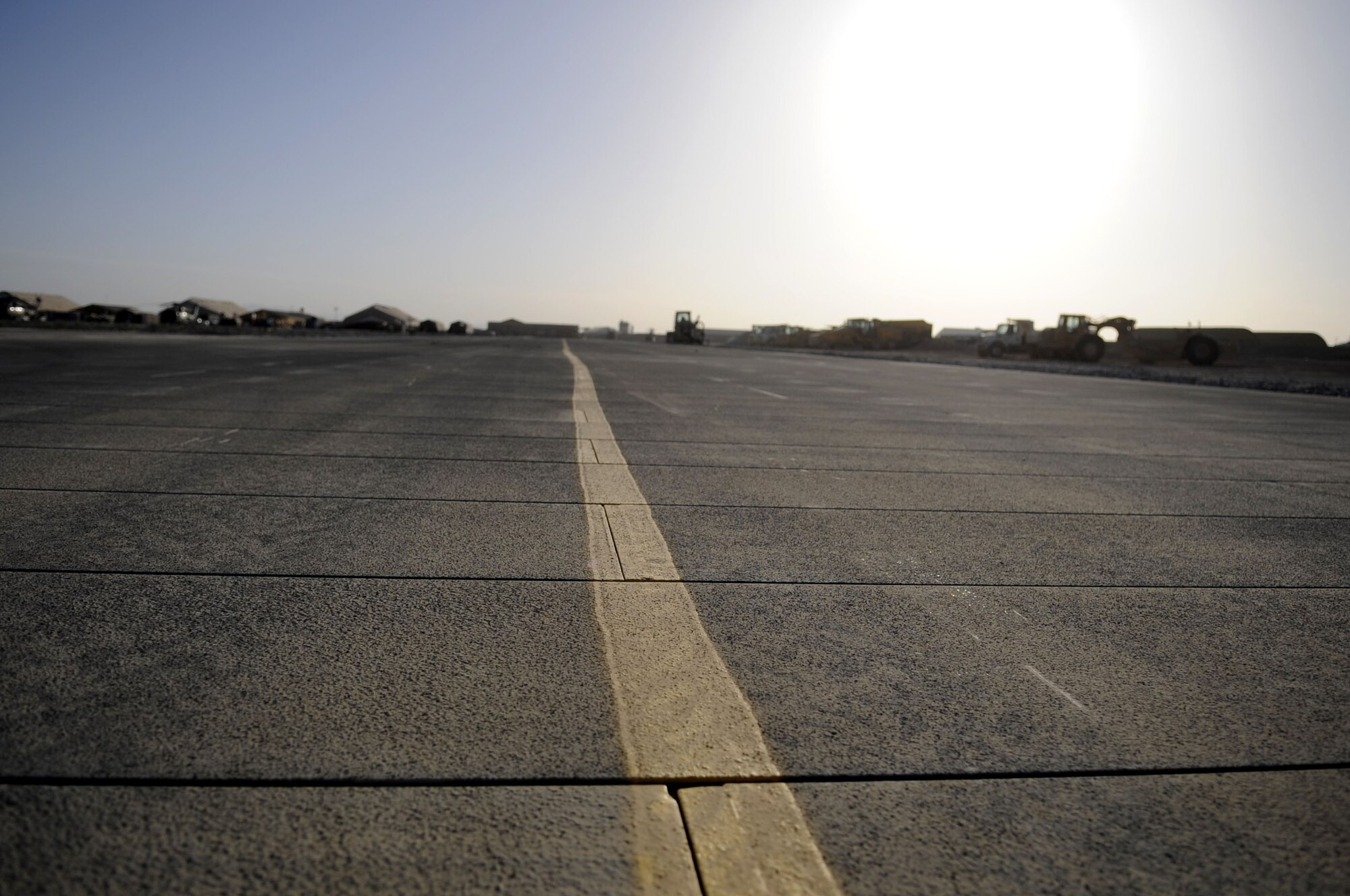 Members of the 809th Expeditionary Red Horse Squadron just completed laying more than 1.5 million cubic square feet of matting on Kandahar Airfield on May 15.  The area is used for taxiways and parking Army helicopters and is worth an estimated $700,000 dollars.  (U.S. Air Force photo by Senior Airman Nancy Hooks/Released)
