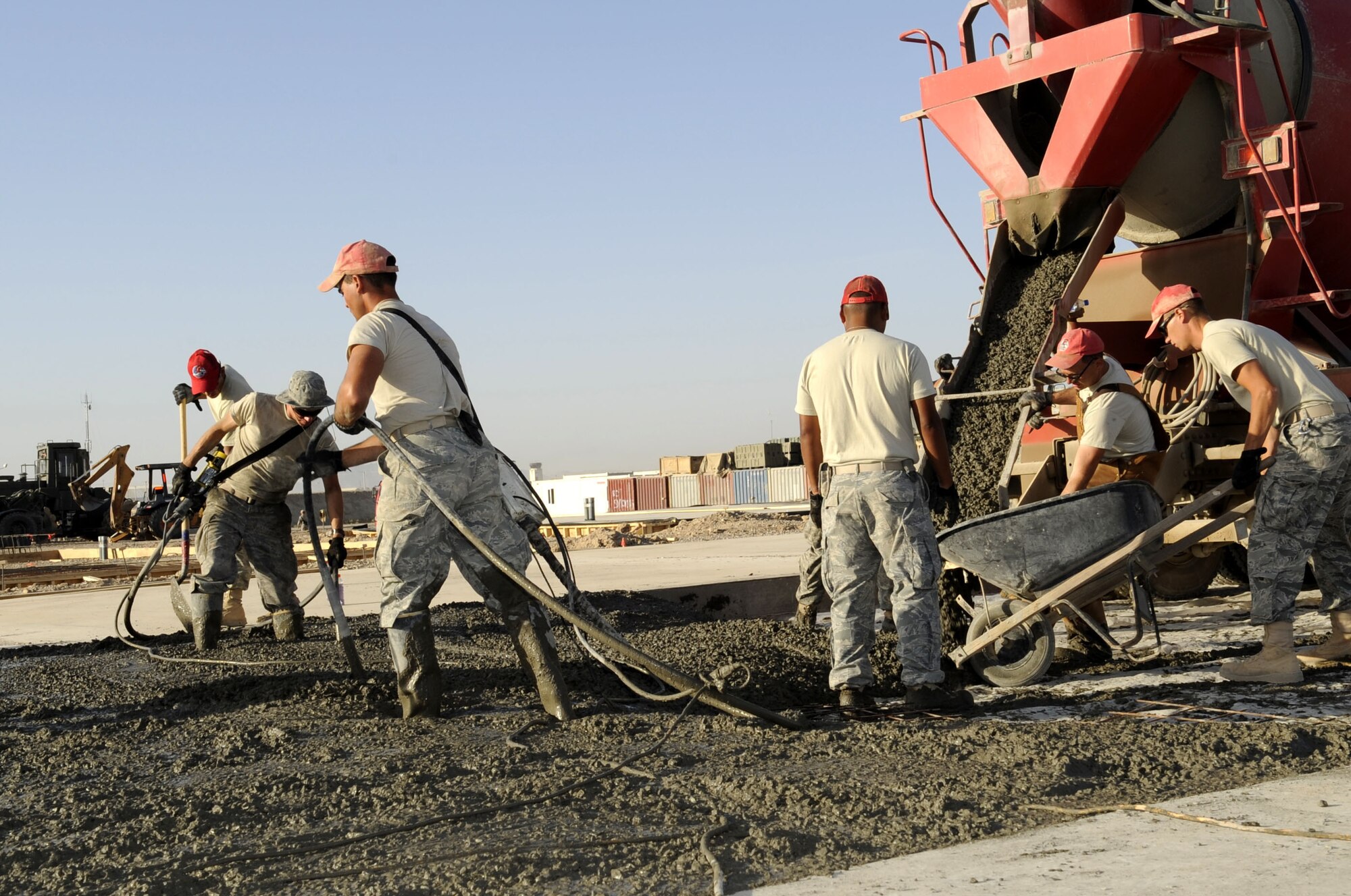 Members of the 809th Expeditionary Red Horse Squadron pour concrete May 15 for the large area maintenance shelter (LAMS) pads for aviation maintenance.  Red Horse squadrons provide the Air Force with a highly mobile civil engineering response force to support contingency and special operations worldwide. (U.S. Air Force photo by Senior Airman Nancy Hooks/Released)