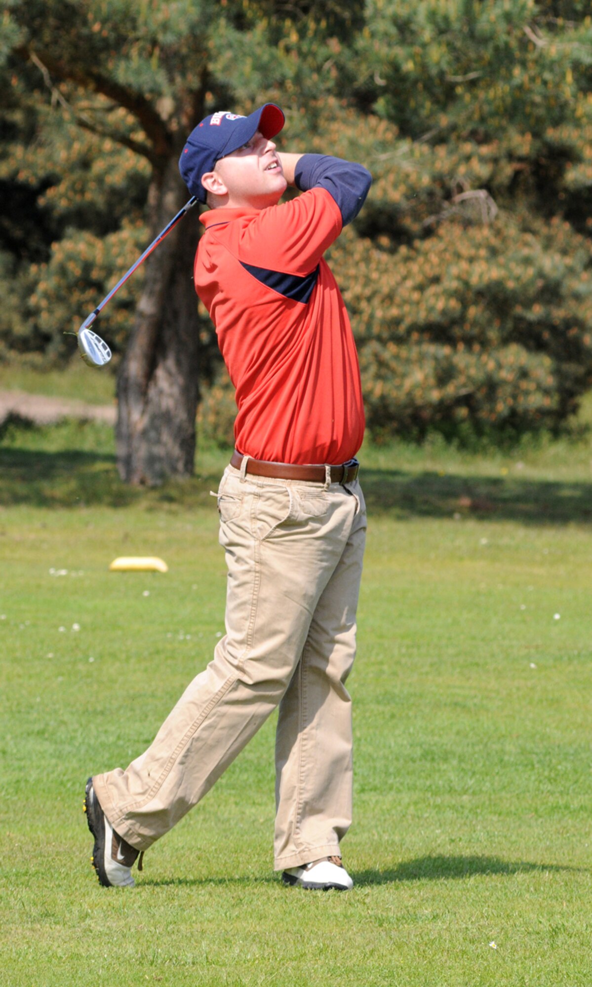 RAF Mildenhall, England -- Andrew Golembiewski, 352nd Maintenance Squadron, follows his wedge shot into the first green during Intramural Golf at Breckland Pines Golf Club, May. 8. Golembiewski, who plays off a 15 handicap ended up on the front edge of the green and gave his team a long birdie opportunity. (U. S. Air Force photo by Gary Rogers)