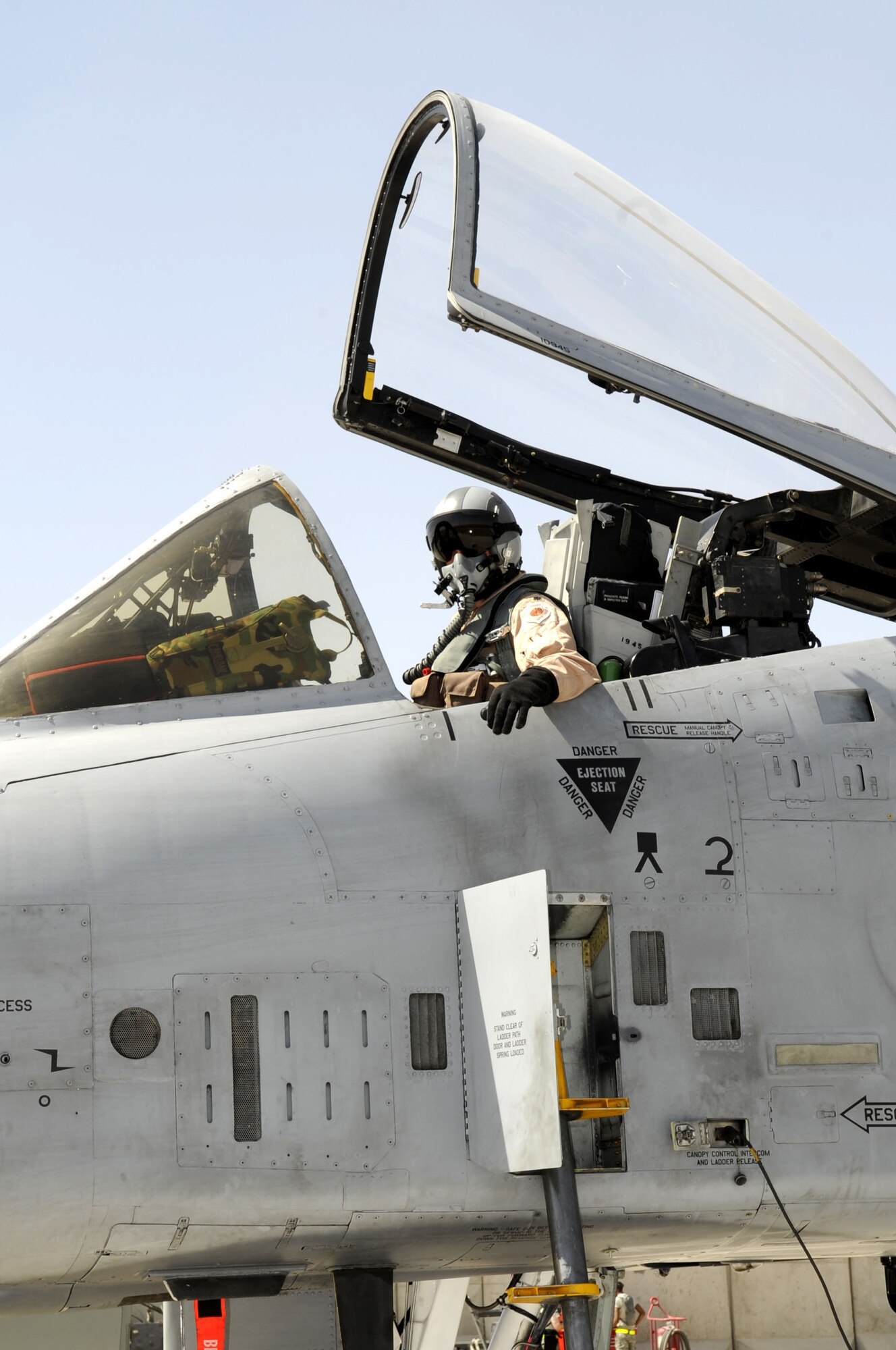 Lt. Col. Ron Stuewe, 81st Expeditionary Fighter Squadron commander, waits in the cockpit for the crew chiefs to do their post flight checks on the A-10 Thunderbolt II aircraft upon landing at Kandahar Airfield May 11. More than 200 members from the 81st Expeditionary Fighter Squadron and the 81st EAMXS deployed here from Spangdahlem Air Base, Germany. Within a two-week period, approximately a dozen jets arrived on KAF. (U.S. Air Force photo by Senior Airman Nancy Hooks)
