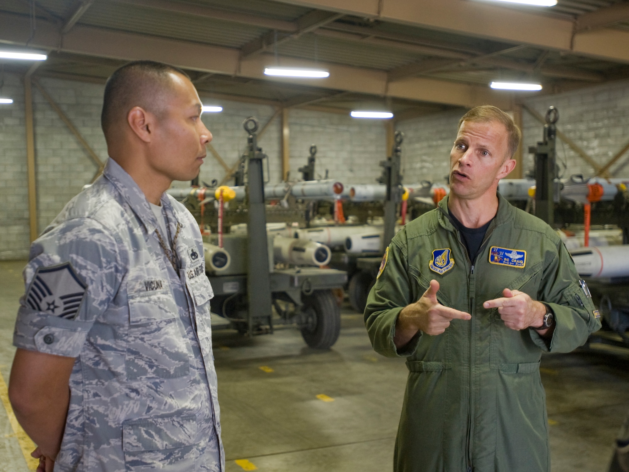 MISAWA AIR BASE, Japan -- Col. RC Craig, 35th Fighter Wing vice commander, and Master Sgt. Victor Vicuna, 35th Maintenance Squadron precision guidance munitions NCO in charge, discuss the base's munitions capabilities during a visit to the 35th MXS's munitions flight May 18. During the visit, Colonel Craig learned more about the munitions flight mission and their plans for future training, exercises and deployments. (U.S. Air Force photo/Senior Airman Jamal D. Sutter)