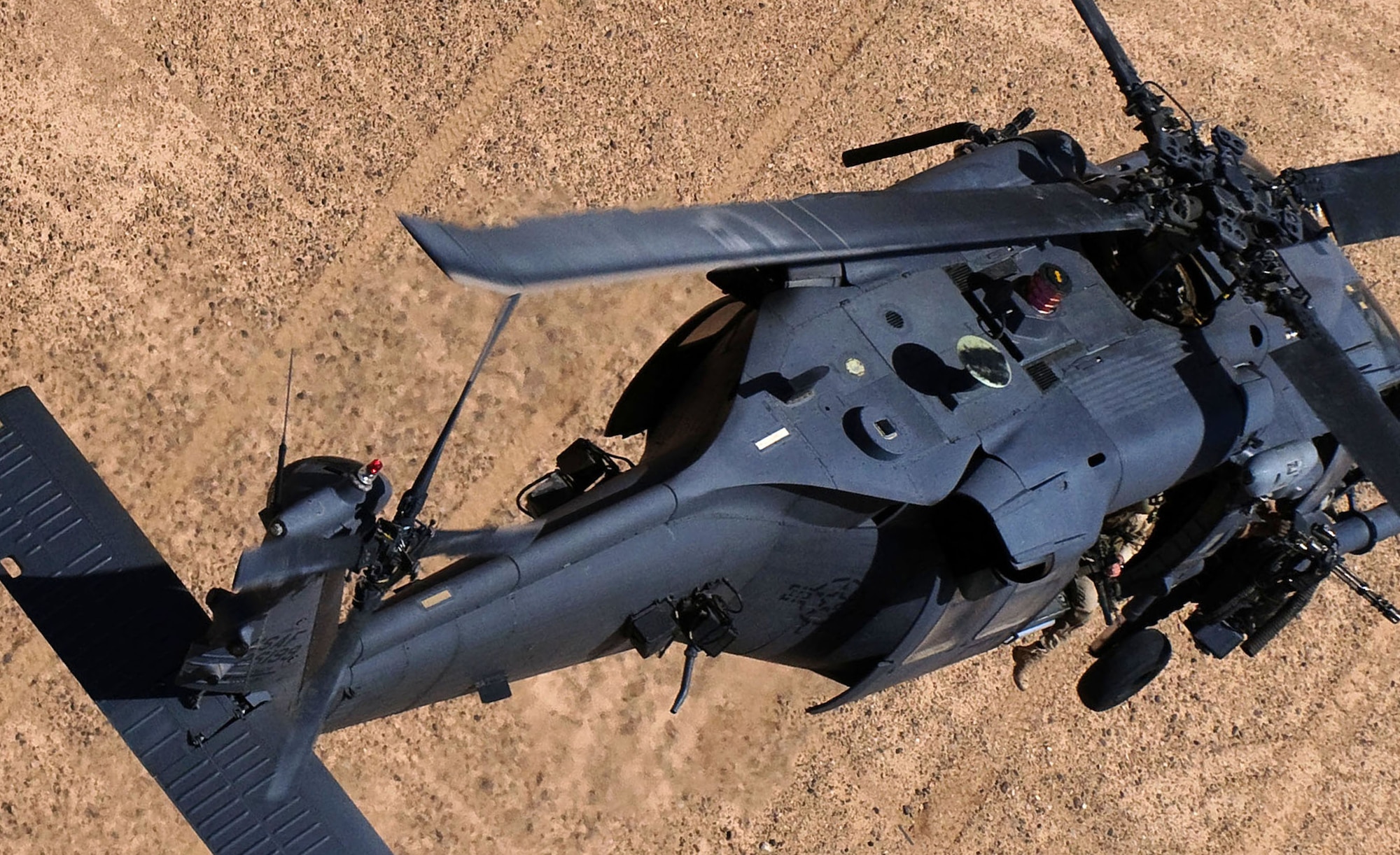 An HH-60G Pavehawk helicopter from the 129th Expeditionary Rescue Squadron flies over Afghanistan June 12, 2009. The crew of Pedro 16, Capt. Robert Rosebrough, 1st Lt. Lucas Will, Master Sgt. Dustin Thomas, and Staff Sgt. Tim Philpott, from Kadena Air Base’s 33rd Rescue Squadron were recently announced as the winners of the MacKay Trophy and the Jolly Green Association Award for a mission to rescue Army Soldiers and fellow Airmen July 29, 2009 during their deployment to Kandahar Air Base.  At the time of the mission they were attached to the 129th ERQS. (Courtesy Photo)