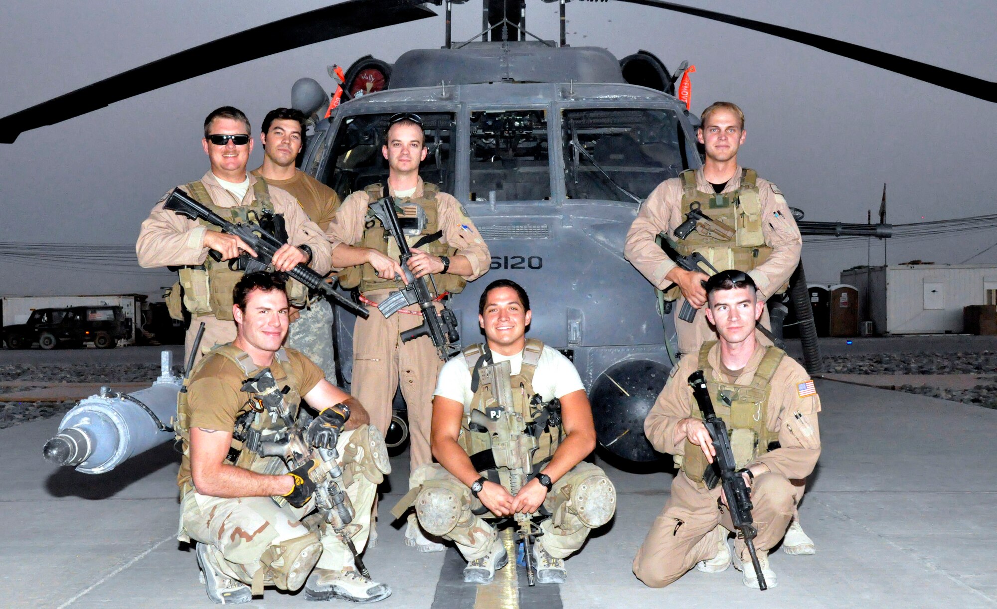The crew of Pedro 16 at Kandahar Air Base, Afghanistan July 2009. Pictured are Capt. Robert Rosebrough (middle, standing), 1st Lt. Lucas Will (right, standing), Master Sgt. Dustin Thomas (far left, standing), and Staff Sgt. Tim Philpott (right, kneeling). The four Airmen, from Kadena Air Base’s 33rd Rescue Squadron, were recently announced as the winners of the MacKay Trophy and the Jolly Green Association Award for a mission to rescue Army Soldiers and fellow Airmen July 29, 2009 during their deployment to Kandahar Air Base. At the time of the mission they were attached to the 129th Expeditionary Rescue Squadron. (Courtesy Photo)