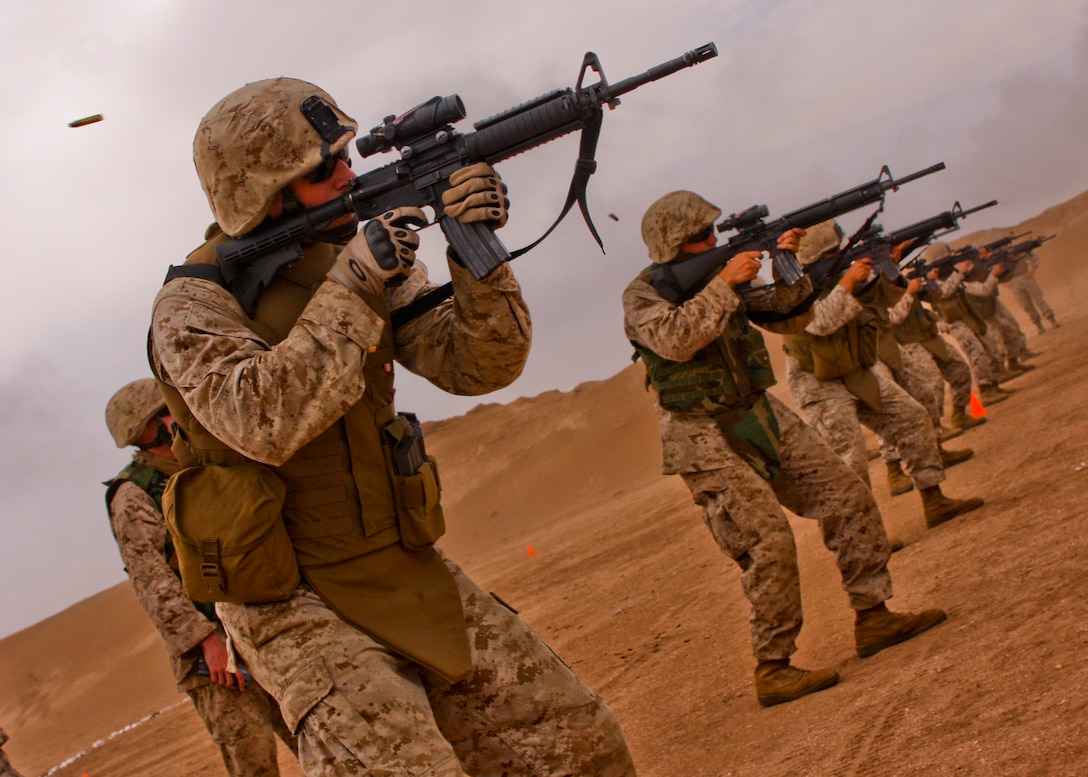 Brig. Gen. James Lariviere (left), the 4th Marine Division commanding general, speaks with Moroccan Army officers during a combined peacekeeping operations training exercise between U.S. Marines and Moroccan Army soldiers May 19.  The Marines are from the 4th MARDIV’s Antiterrorism Battalion, headquartered in Lafayette, La.  Lariviere recently took command of the division in April.