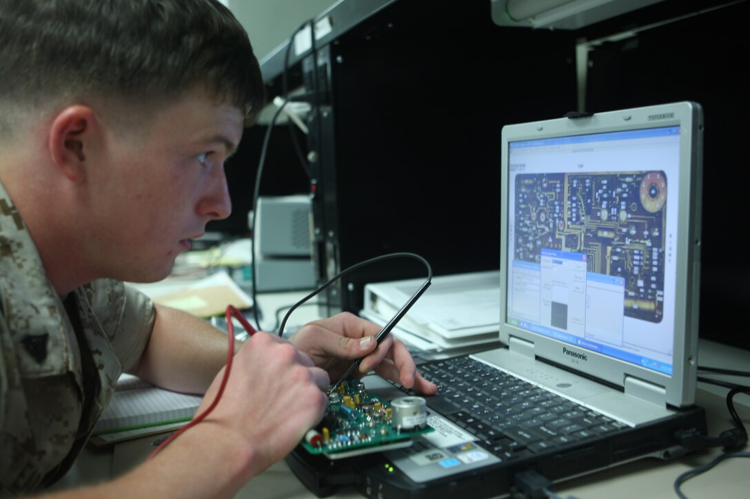 A Marine with Wire Platoon, Electronics Maintenance Company, 2nd Maintenance Battalion, Combat Logistics Regiment 25, 2nd Marine Logistics Group troubleshoots a circuit card with a USM-674, a device which introduces low-level electrical currents through the card to detect any discrepancies in the electricity’s path, May 20. ELMACO reaches to outside vendors for parts not offered by the Marine Corps to repair expensive cards as opposed to buying new ones.