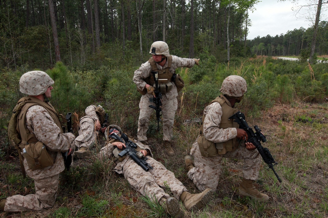 Marines with Mobility Assault Company, 2nd Combat Engineer Battalion, 2nd Marine Division, work to evacuate a mock casualty during training March 30. The scenario required Marines to transport the fallen Marine and use proper radio techniques to call for support during the three-day Improvised Explosive Device Awareness course.  The battalion is currently preparing its Marines for an upcoming deployment to Afghanistan.