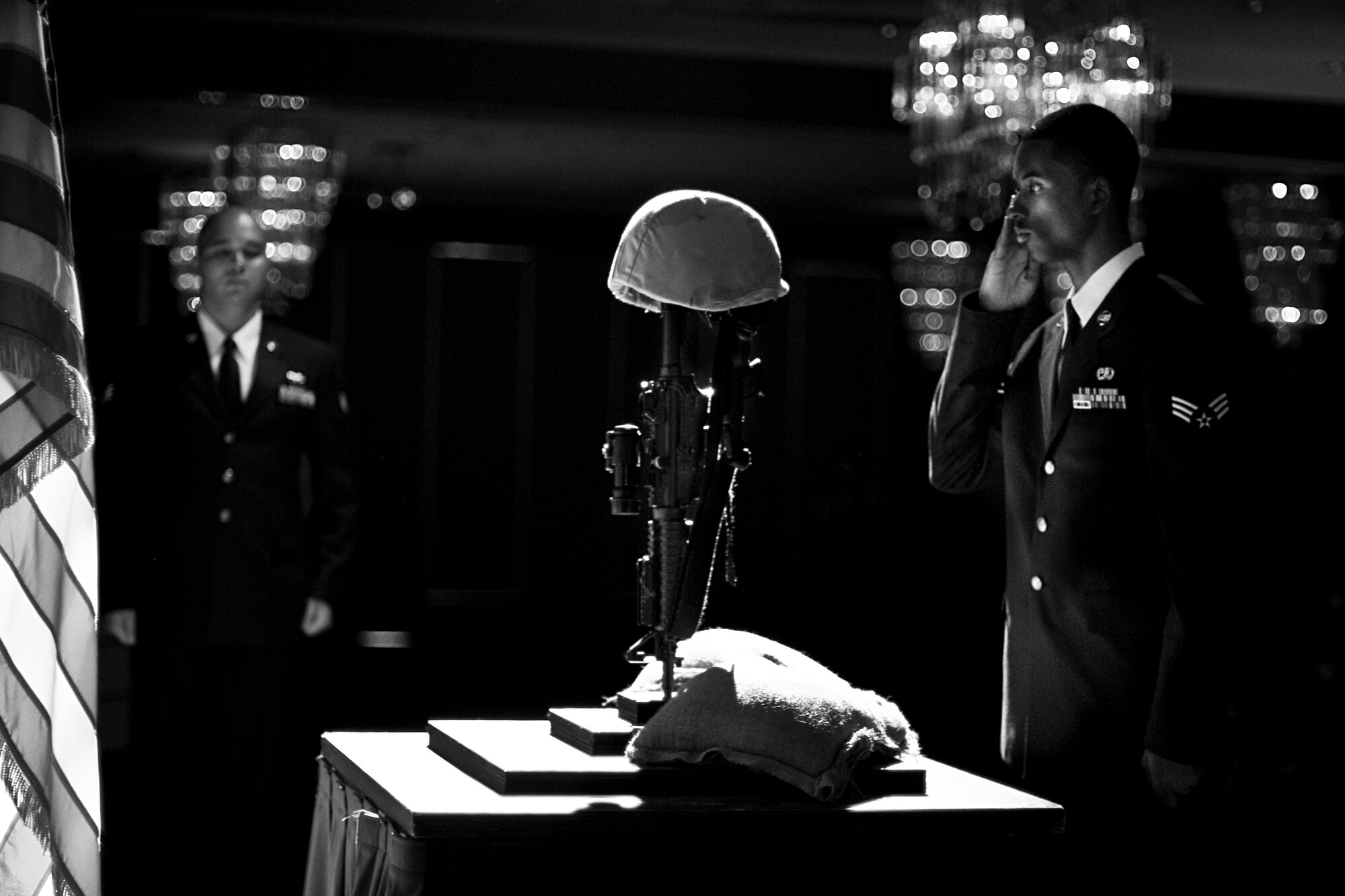 MISAWA AIR BASE, Japan -- Senior Airman Robert Leggett, 35th Aircraft Maintenance Squadron aerospace electrical and environmental systems specialist, participates in a Fallen Warriors Presentation during an Airman Leadership School graduation May 20 at the Collocated Club. Airman Leggett was a graduate of ALS Class 10-D, which prepared 24 Airmen for the next stages of their careers. (U.S. Air Force photo/Senior Airman Jamal D. Sutter)