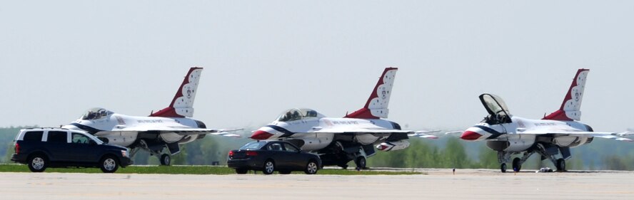 Col. Don Shaffer, 319th Air Refueling Wing commander, drives onto the flightline to greet the United States Air Force Thunderbird Aerial Demonstration Team, as they land on Grand Forks Air Force Base, N.D. May 20. The Thunderbirds will highlight the base’s Thunder over the Red River Air Show May 22. (U.S. Air Force photo by Airman 1st Class Amber Price)