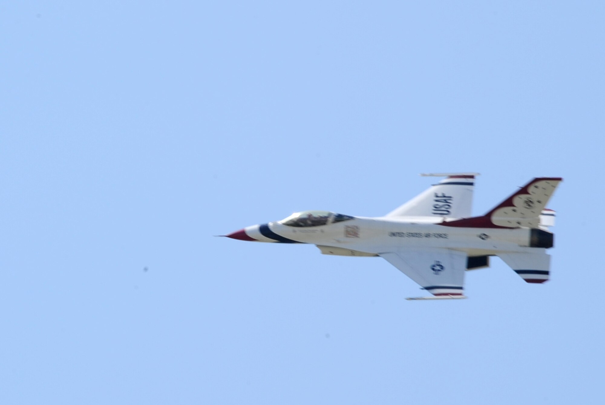 An F-16 Fighting Falcon, part of the United States Air Force Thunderbird Aerial Demonstration Team, flies over Grand Forks Air Force Base, N.D., before landing May 20. The Thunderbirds will highlight the base’s Thunder over the Red River Air Show May 22. (U.S. Air Force photo by Airman 1st Class Amber Price)
