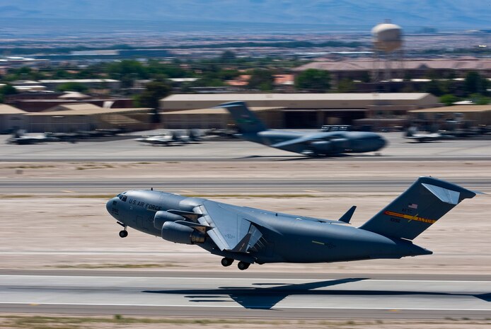 NELLIS AIR FORCE BASE, Nev. -- A C-17 Globemaster III assigned to the 97th Air Mobility Wing, Altus AFB, Okla., from Nellis Air Force Base following a Mobility Air Forces Exercise May 19. Approximately 40 C-17 Globemaster III and C-130 Hercules aircraft from Air Force bases in Alaska and the Continental United States met over the Nevada Test and Training Range to conduct air and ground operations as part of the bi-annual exercise which is planned and executed by students assigned to the U.S. Air Force Weapons School. (U.S. Air Force Photo by Airman 1st Class Brett Clashman)
