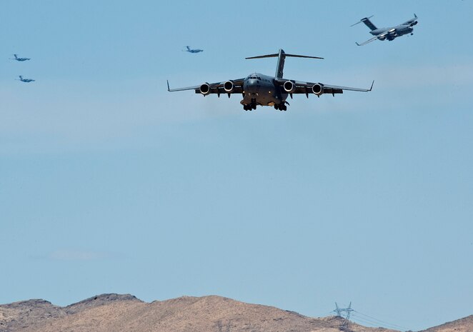 NELLIS AIR FORCE BASE, Nev. -- C-17 Globemaster III's prepare to land at Nellis Air Force Base after a Mobility Air Forces Exercise May 19. Approximately 40 C-17 Globemaster III and C-130 Hercules aircraft from Air Force bases in Alaska and the Continental United States met over the Nevada Test and Training Range to conduct air and ground operations as part of the bi-annual exercise which is planned and executed by students assigned to the U.S. Air Force Weapons School. (U.S. Air Force Photo by Airman 1st Class Brett Clashman)