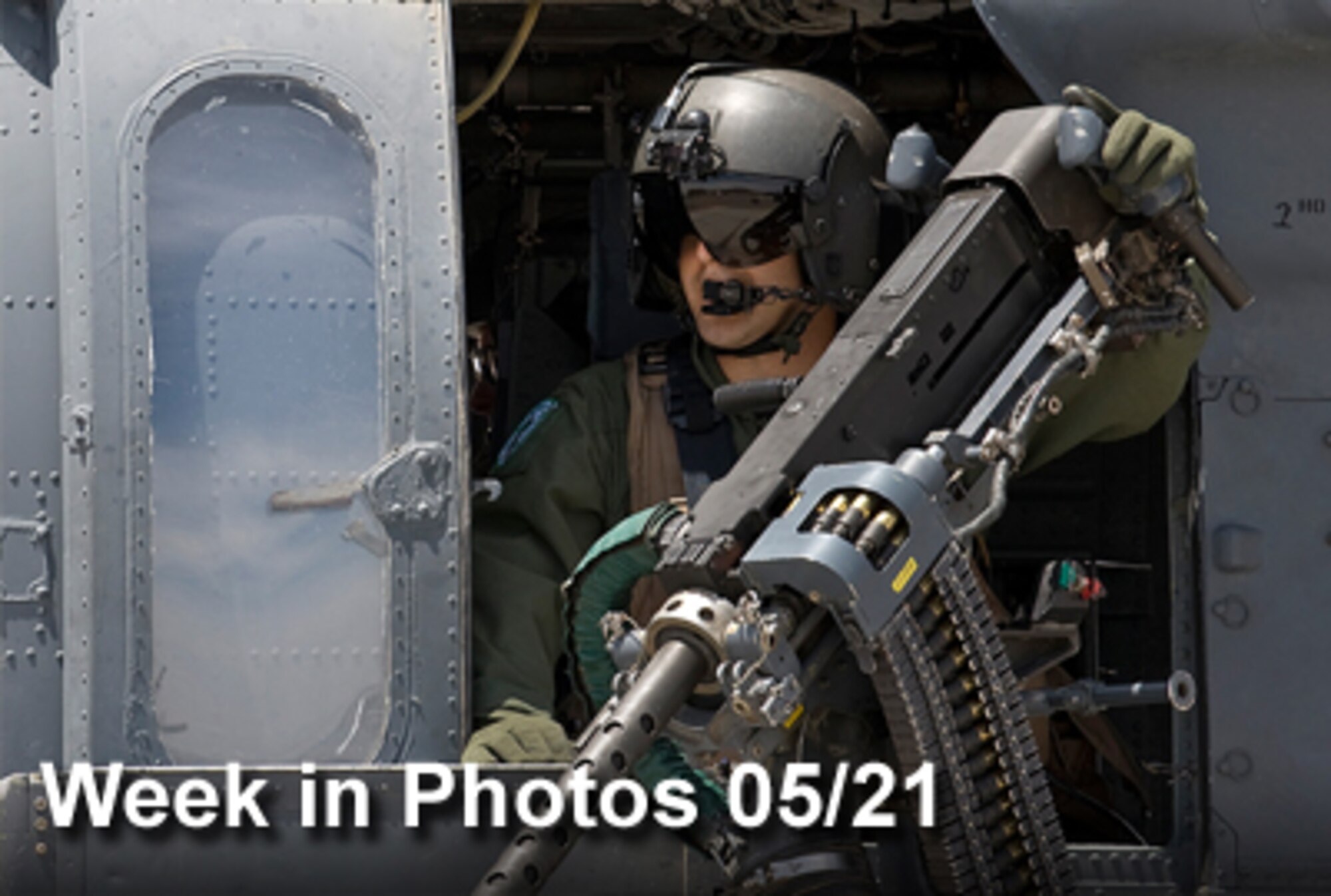 Air Force Week in Photos for May 21, 2010, highlights photos from around the Air Force. In this photo by Airman 1st Class Brett Clashman, Staff Sgt. Kevin Darosa waits to take off as part of a scramble exercise May 13, 2010, at the flightline at Nellis Air Force Base, Nev. Sergeant Darosa is an helicopter aerial gunner with the 66th Rescue Squadron. (U. S. Air Force photo illustration)