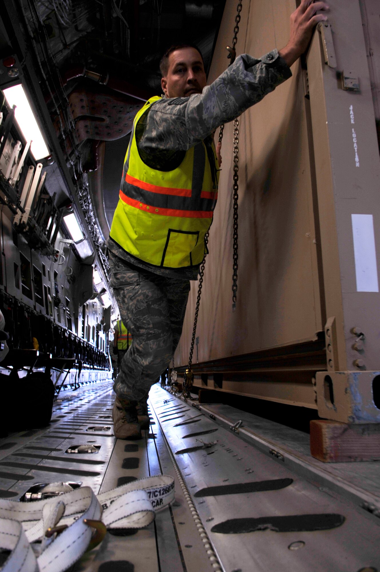 HOLLOMAN AIR FORCE BASE, N.M. -- Tech. Sgt. Christhopher Worthen, 49th Logistics Readiness Squadron, helps load cargo into a C-17 Globemaster, May 19, 2010. This is the first of several airlift missions taking 49th Fighter Wing assets to Kadena AB, Japan, in support of a U.S. Pacific Command Theater Security Package. ( U.S. Air Force photo by Airman 1st Class Joshua Turner / Released)