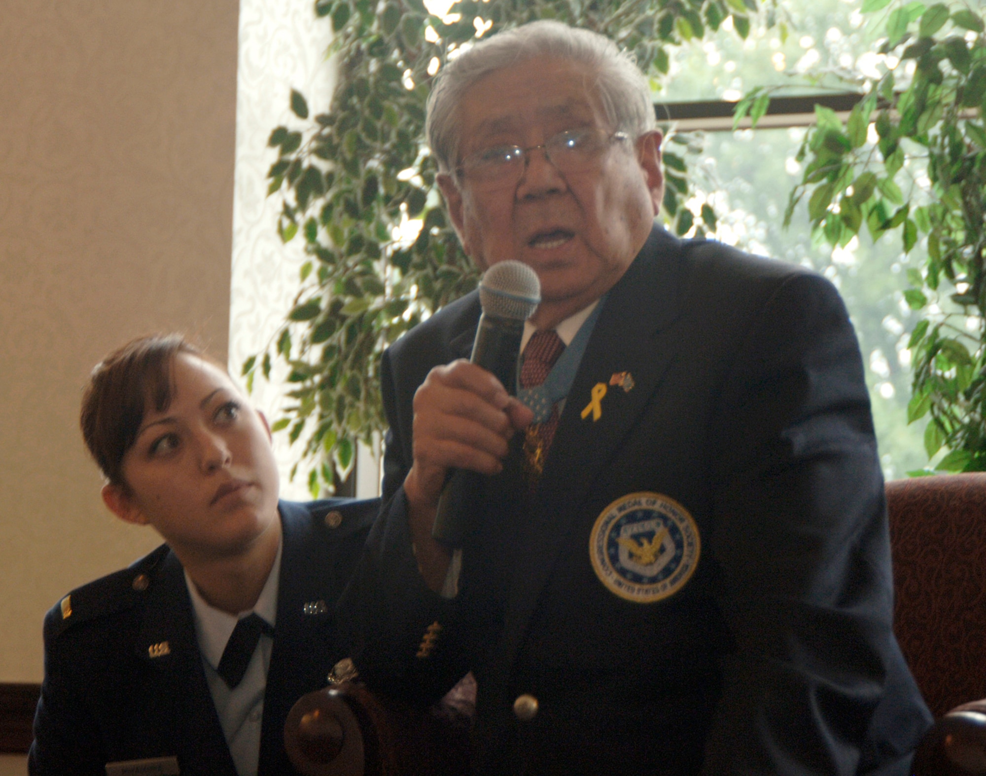 Medal of Honor recipient Hiroshi Miyamura answers questions May 17, 2010, at Scott Air Force Base, Ill., about his ordeal as a Korean War prisoner of war, with 2nd Lt. Marisa Miyamura by his side. Mr. Miyamura shared his experiences as a Korean War veteran and POW with members at Scott AFB as part of Asian-Pacific American Heritage Month celebrations. Lieutenant Miyamura is Mr. Miyamura's granddaughter. (U.S. Air Force photo/Karen Petitt) 