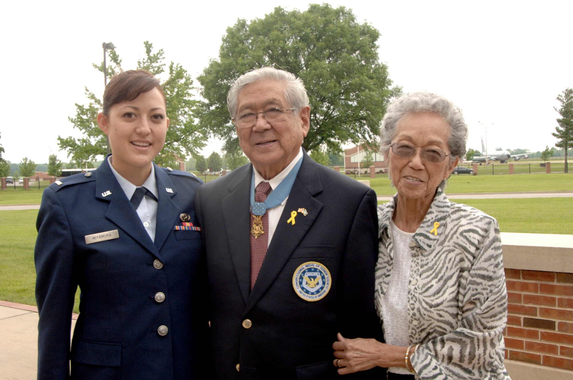 Medal of Honor recipient Hiroshi Miyamura stands with 2nd Lt. Marisa Miyamura, his granddaughter, and Terry, his wife of 62 years May 17, 2010, at Scott Air Force Base, Ill. Mr. Miyamura shared his experiences as a Korean War veteran and POW with members at Scott AFB as part of Asian-Pacific American Heritage Month celebrations. Lieutenant Miyamura is a communications officer assigned to Scott AFB. (U.S. Air Force photo/Karen Petitt)