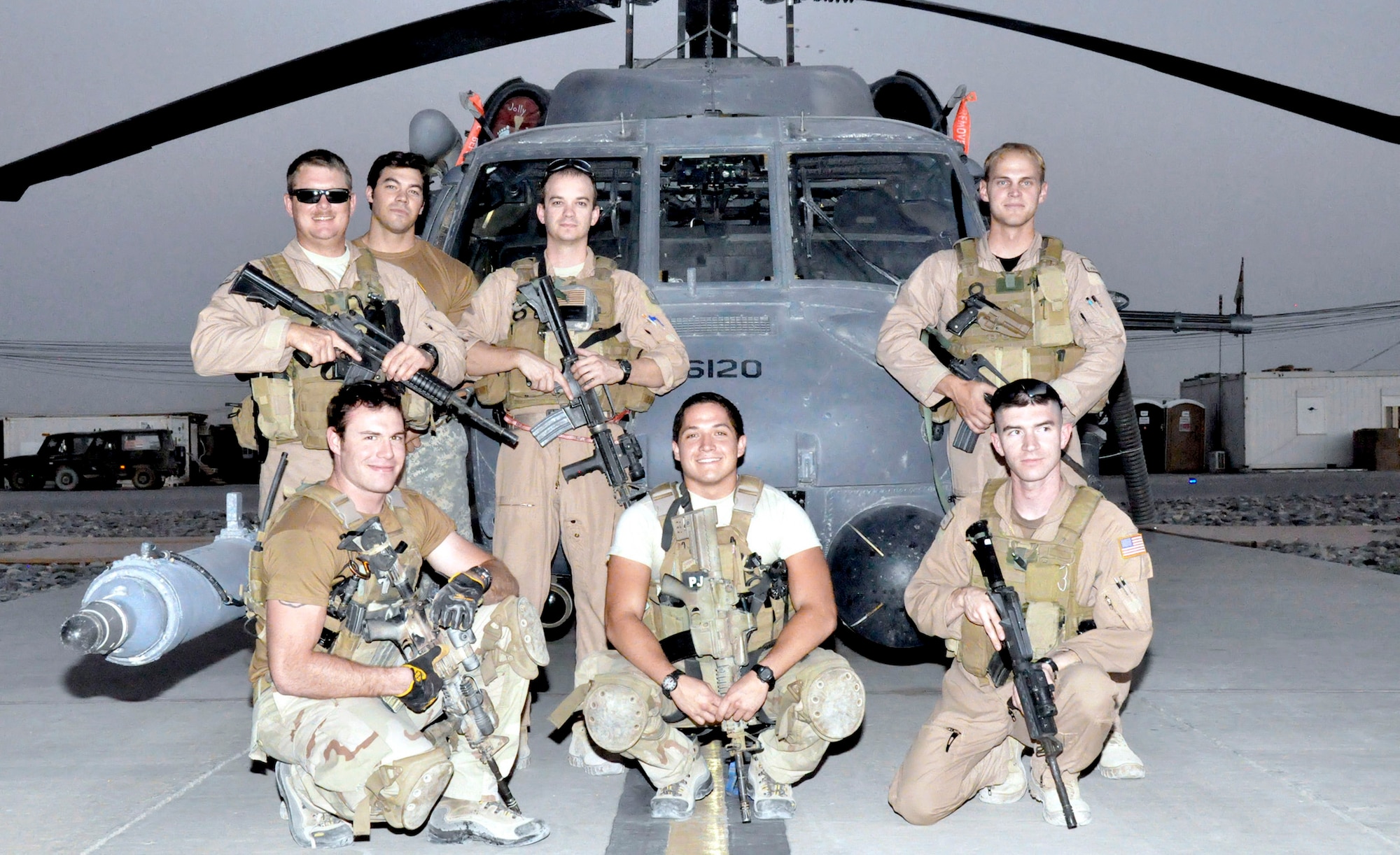 The crew of "Pedro 16" poses in July 2009, at Kandahar Airfield, Afghanistan. Pictured are Capt. Robert Rosebrough (middle, standing), 1st Lt. Lucas Will (right, standing), Master Sgt. Dustin Thomas (far left, standing) and Staff Sgt. Tim Philpott (right, kneeling). The four Airmen from Kadena Air Base's 33rd Rescue Squadron, were recently announced as the 2009 MacKay Trophy winners. (Courtesy photo) 