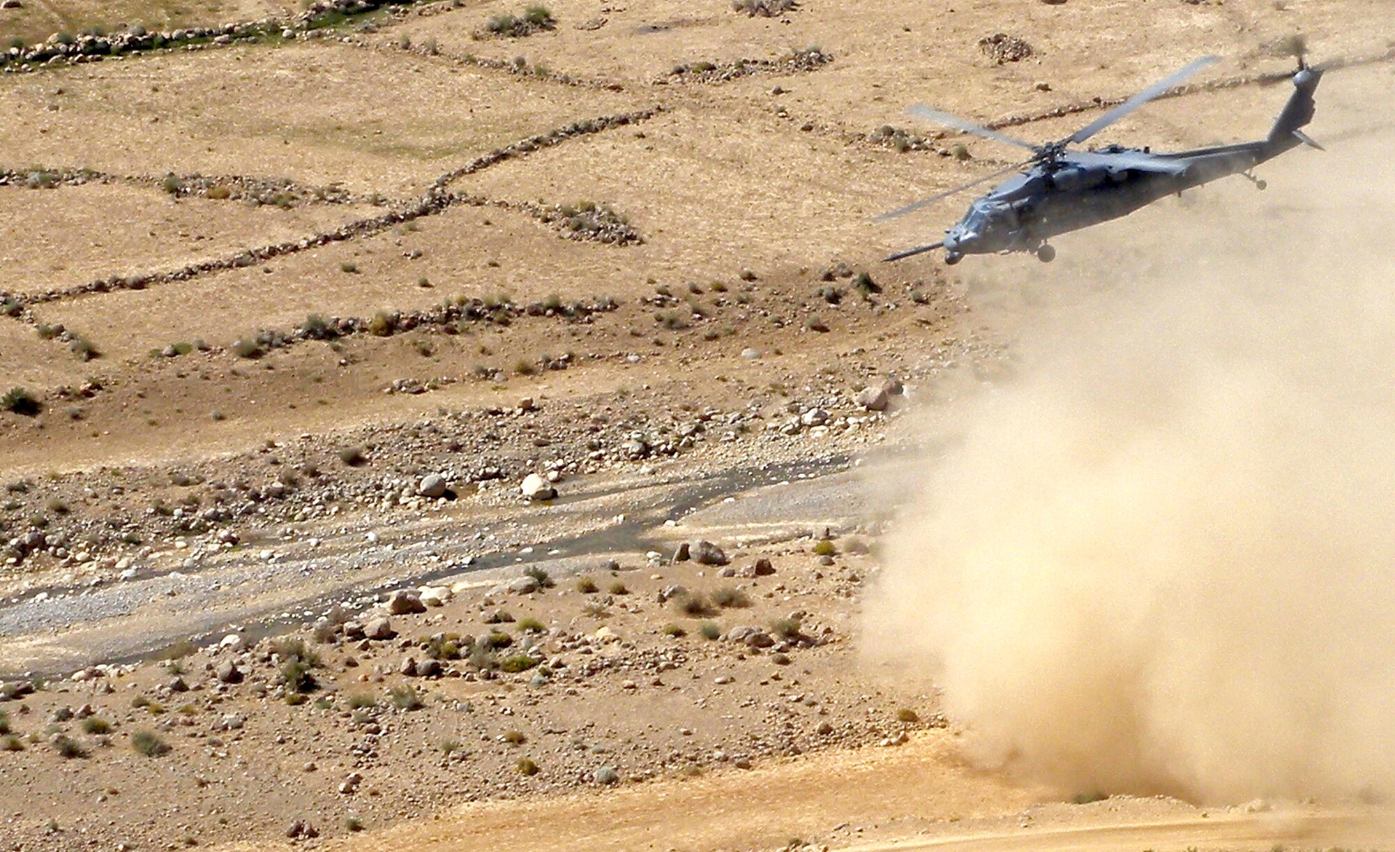 An HH-60G Pavehawk from the 129th Expeditionary Rescue Squadron flies June 12, 2009, over Afghanistan. The crew of "Pedro 16", Capt. Robert Rosebrough, 1st Lt. Lucas Will, Master Sgt. Dustin Thomas and Staff Sgt. Tim Philpott, from the 33rd Rescue Squadron at Kadena Air Base, Japan, were recently announced as the 2009 MacKay Trophy winners. (Courtesy photo) 