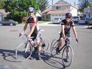 U.S. Air Force Reserve Senior Master Sgt. James Frigo, Sr., (left) and his son, James “Bubba” Frigo, Jr., depart from their home in Menifee, Calif., on a training ride May 15, 2010 with their brand new road bikes.  Sergeant Frigo is the fuels superintendent with the 452nd Logistics Readiness Squadron at March Air Reserve Base, Calif.  The two plan to ride across the United States to raise awareness about retinitis pigmentosa, a degenerative condition Bubba was diagnosed with that leads to eventual blindness.  (Photo courtesy Senior Master Sgt. James Frigo, Sr.)
