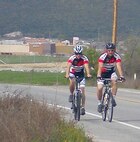 Air Force Reserve Senior Master Sgt. James Frigo, Sr., (right) and his son, James “Bubba” Frigo, Jr., pedal side by side March 5, 2010, near their home in Menifee, Calif., during a training ride for their upcoming 4,000-mile trip across the United States to raise awareness about retinitis pigmentosa, a degenerative condition Bubba was diagnosed with that leads to eventual blindness.  Before a bicycle company loaned the Frigos road bikes for the trip, the two trained on hybrid mountain bikes.  (Photo courtesy Senior Master Sgt. James Frigo, Sr.)