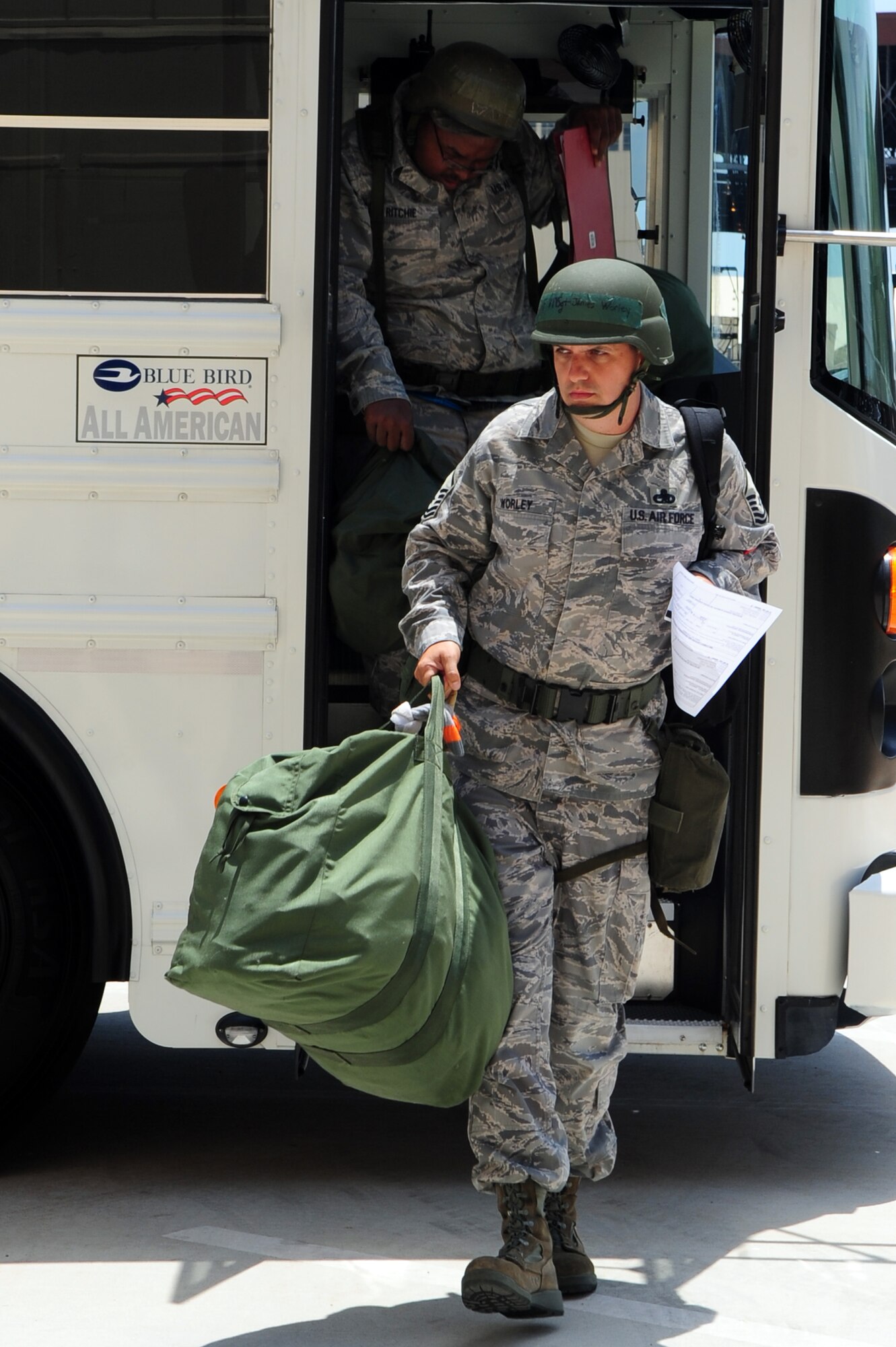 BARKSDALE AIR FORCE BASE, La. – Master Sgt. James Worley, 2d Aircraft Maintenance Squadron exits a bus at Hoban Hall to process through a mock deployment line as part of a Nuclear Operational Readiness Exercise May 18. With a Nuclear Operational Readiness Inspection this summer, Barksdale Airmen are expected to adapt and overcome, perform with fewer errors and properly execute missions during the NOREs in mid-May and early June. (U.S. Air Force photo by Senior Airman Joanna M. Kresge)