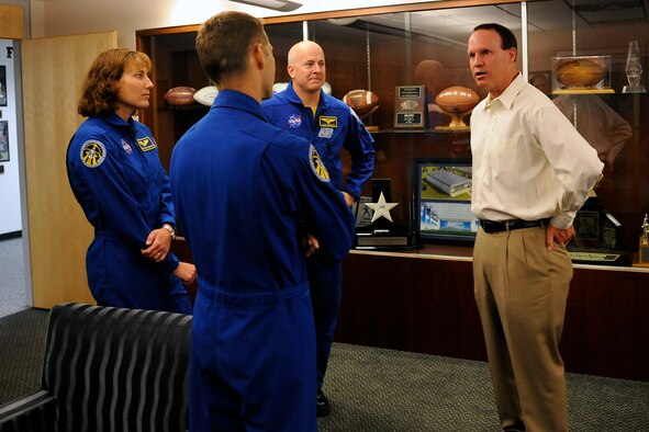 From left: Dorothy Metcalf-Lindenberger, Col. Jim Dutton and Navy Capt. Alan Poindexter talk with Air Force football head coach Troy Calhoun during a "NASA victory tour" visit to the Academy May 18, 2010. The three astronauts were part of the crew for the Space Shuttle Atlantis' STS-131 mission to the International Space Station in April. (U.S. Air Force photo/J. Rachel Spencer)